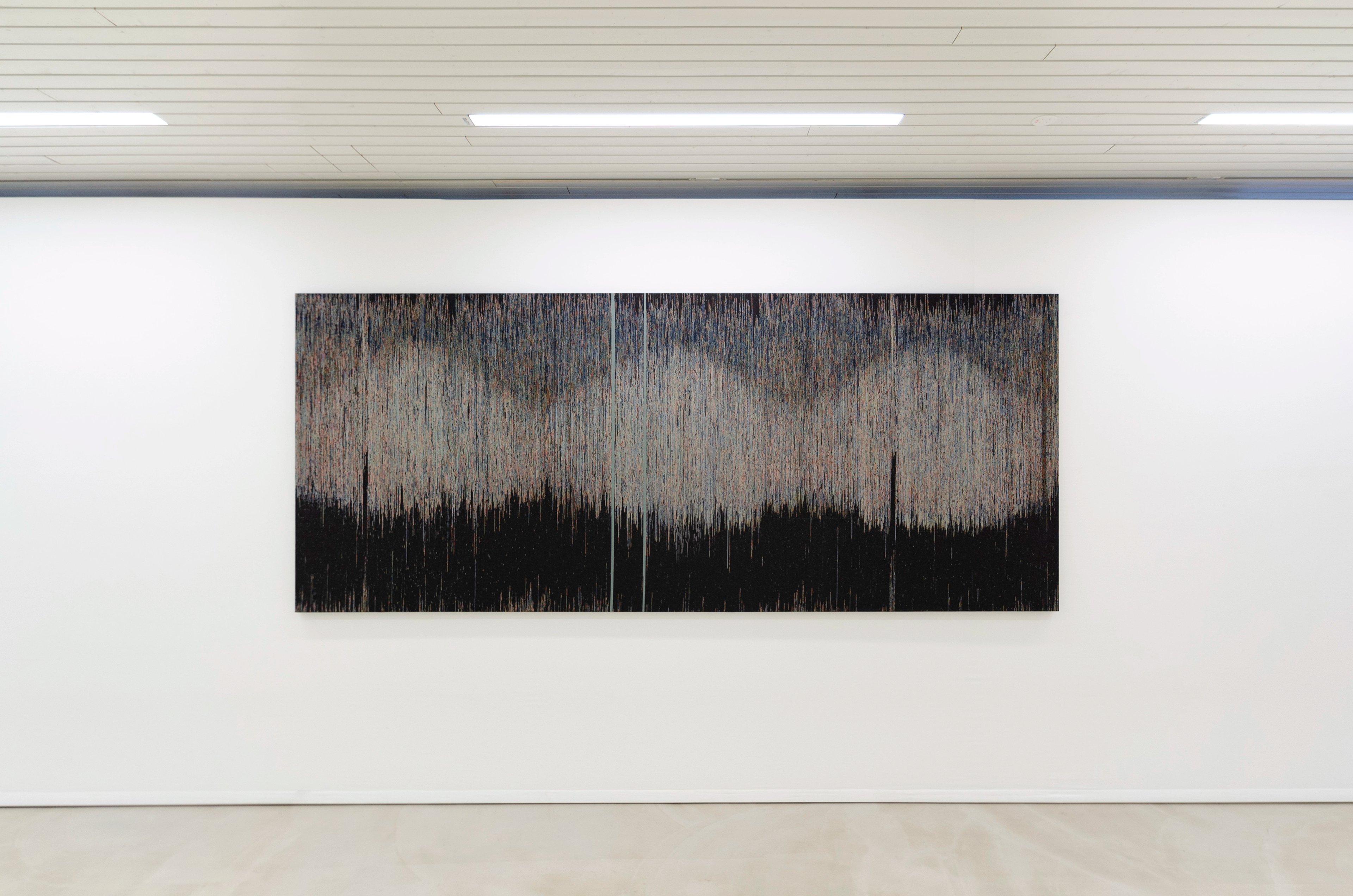 Horizontal jacquard tapestry with dense vertical striations transitioning from grey and beige tones at top to black at bottom, resembling an abstract wavefor…