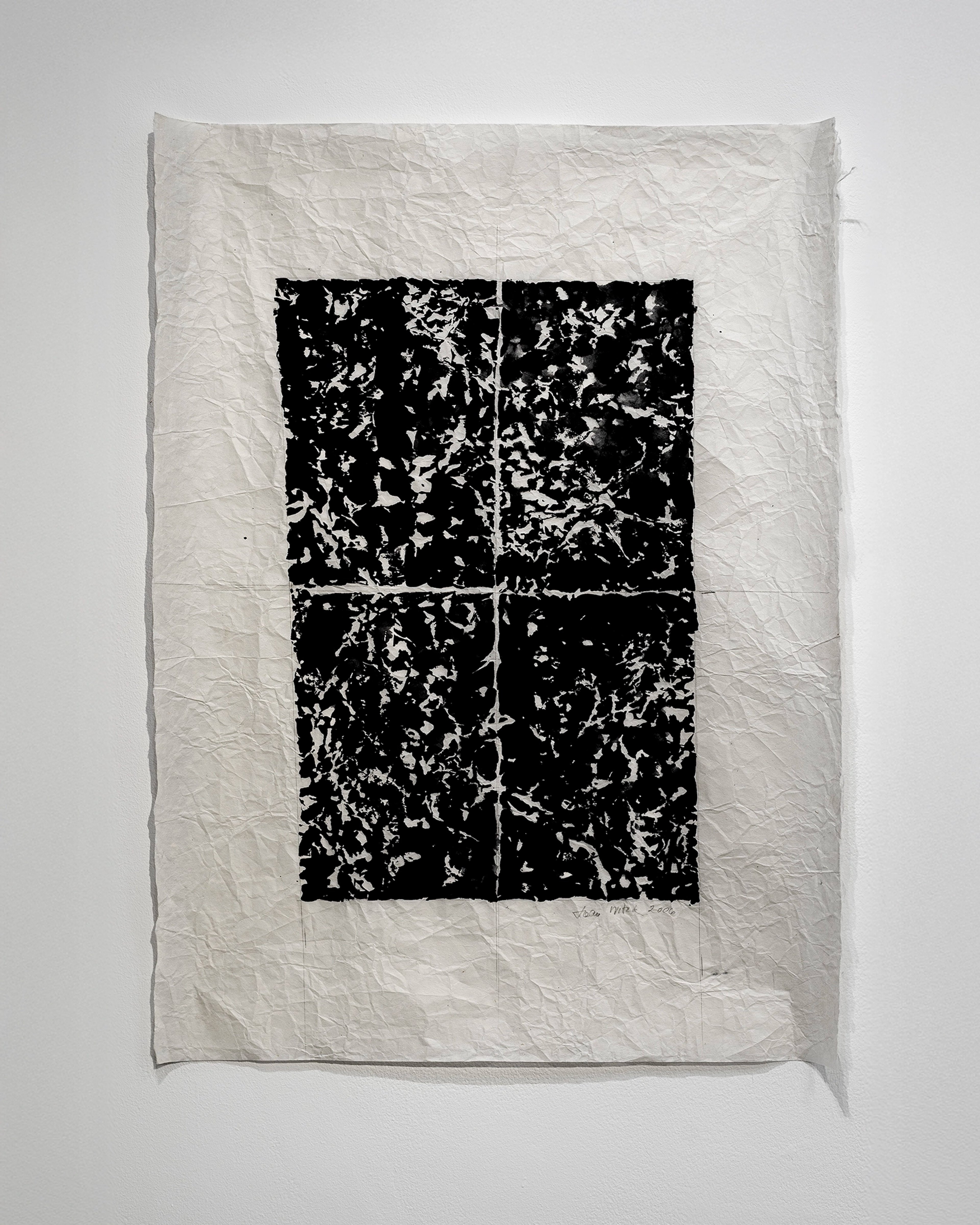 Crumpled cream ricepaper with four black rectangles divided by a central cross, filled with white spattered marks resembling gestural abstraction or splatter…