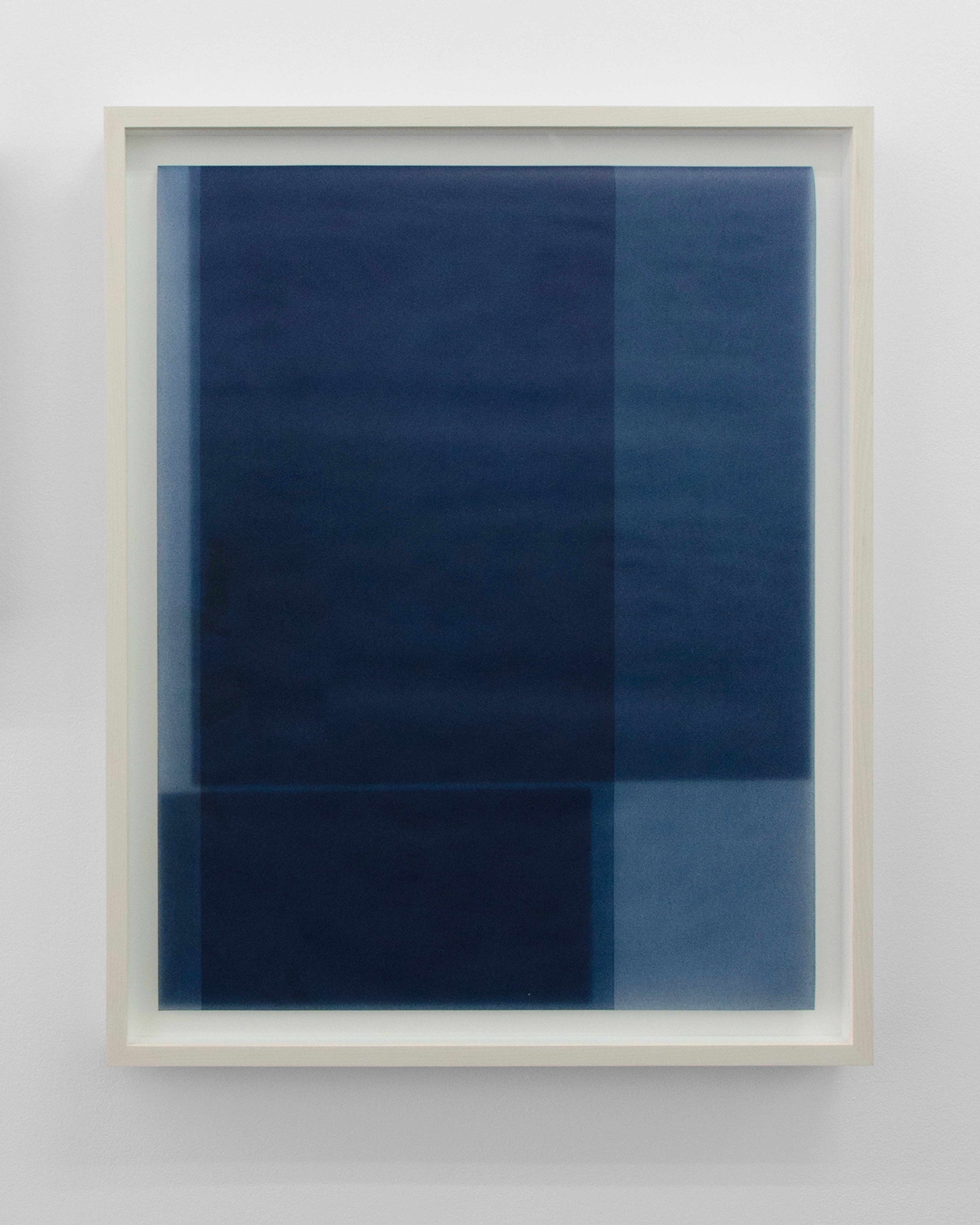 Abstract composition of layered rectangles in deep navy and lighter blue tones, created with pigments and wax on paper in a white frame