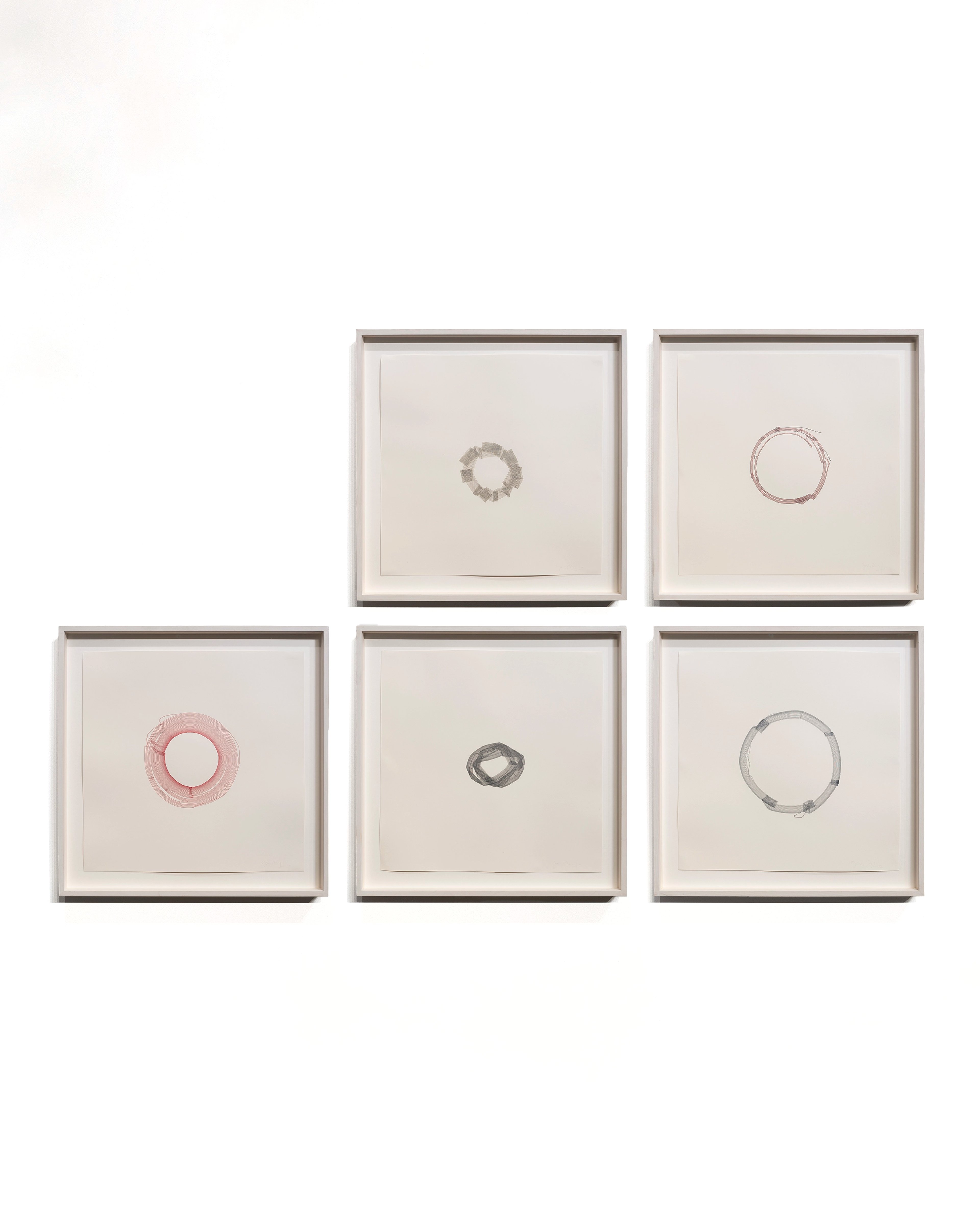 Five framed drawings on cream paper arranged asymmetrically, each containing a single hand-drawn circle in graphite, pink, or red pigment, varying in size an…