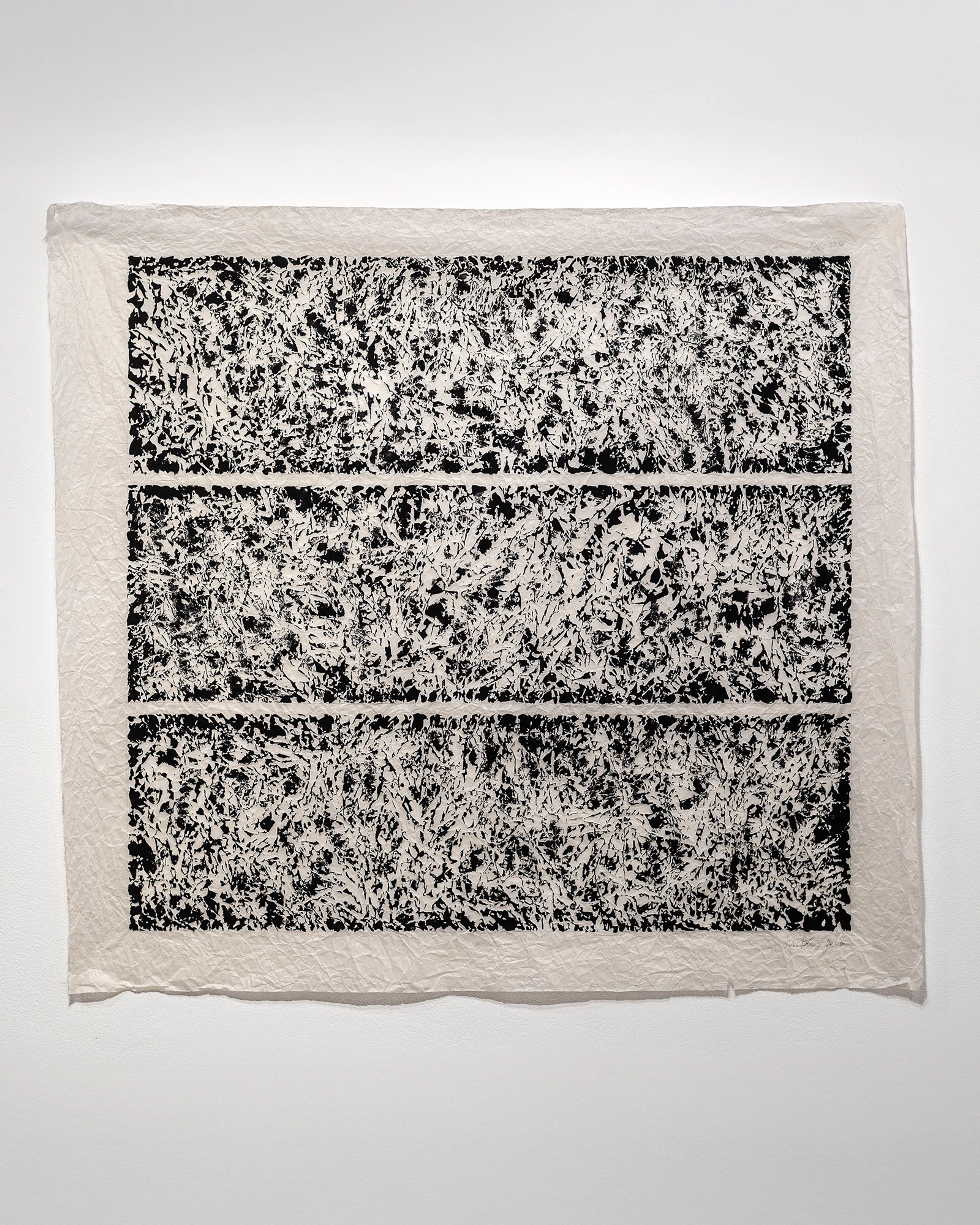 Three horizontal black and white textured panels with dense, gestural mark-making on natural ricepaper with visible deckled edges.