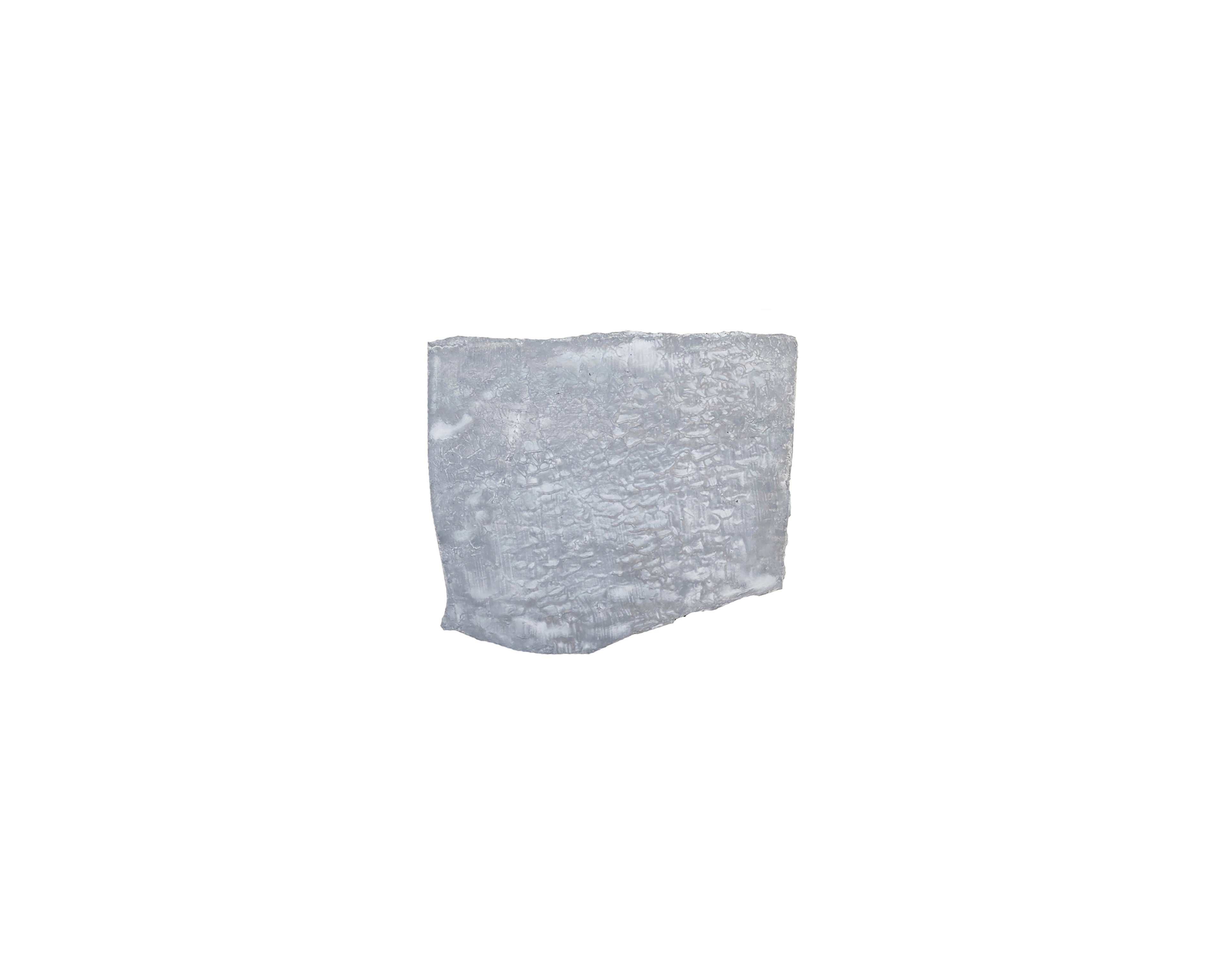 Pale grey watercolour painting depicting a rough-textured rectangular form with irregular edges against a white background
