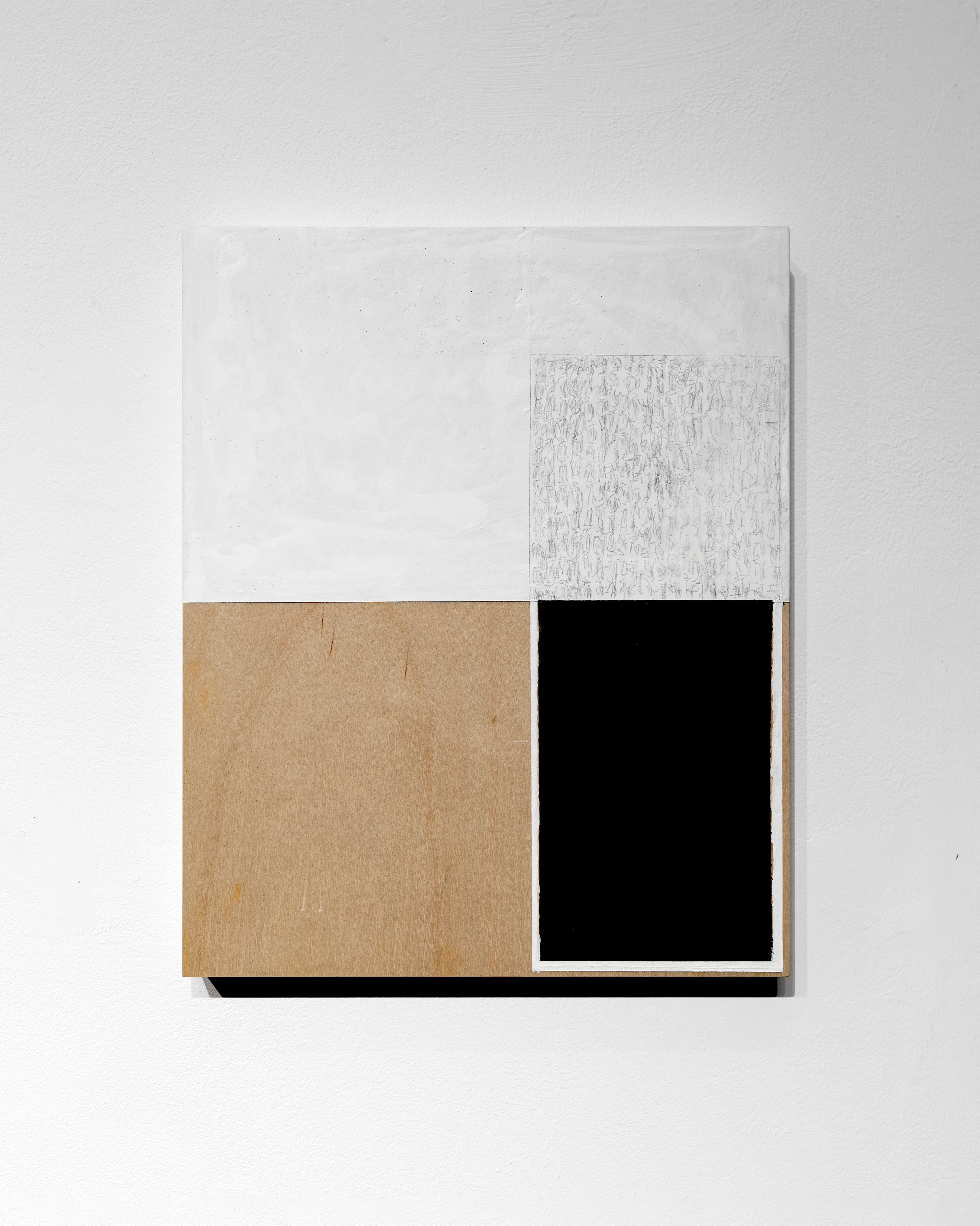 Geometric composition of four rectangular sections in white acrylic, textured grey pencil, natural wood tan, and solid black on wooden panel