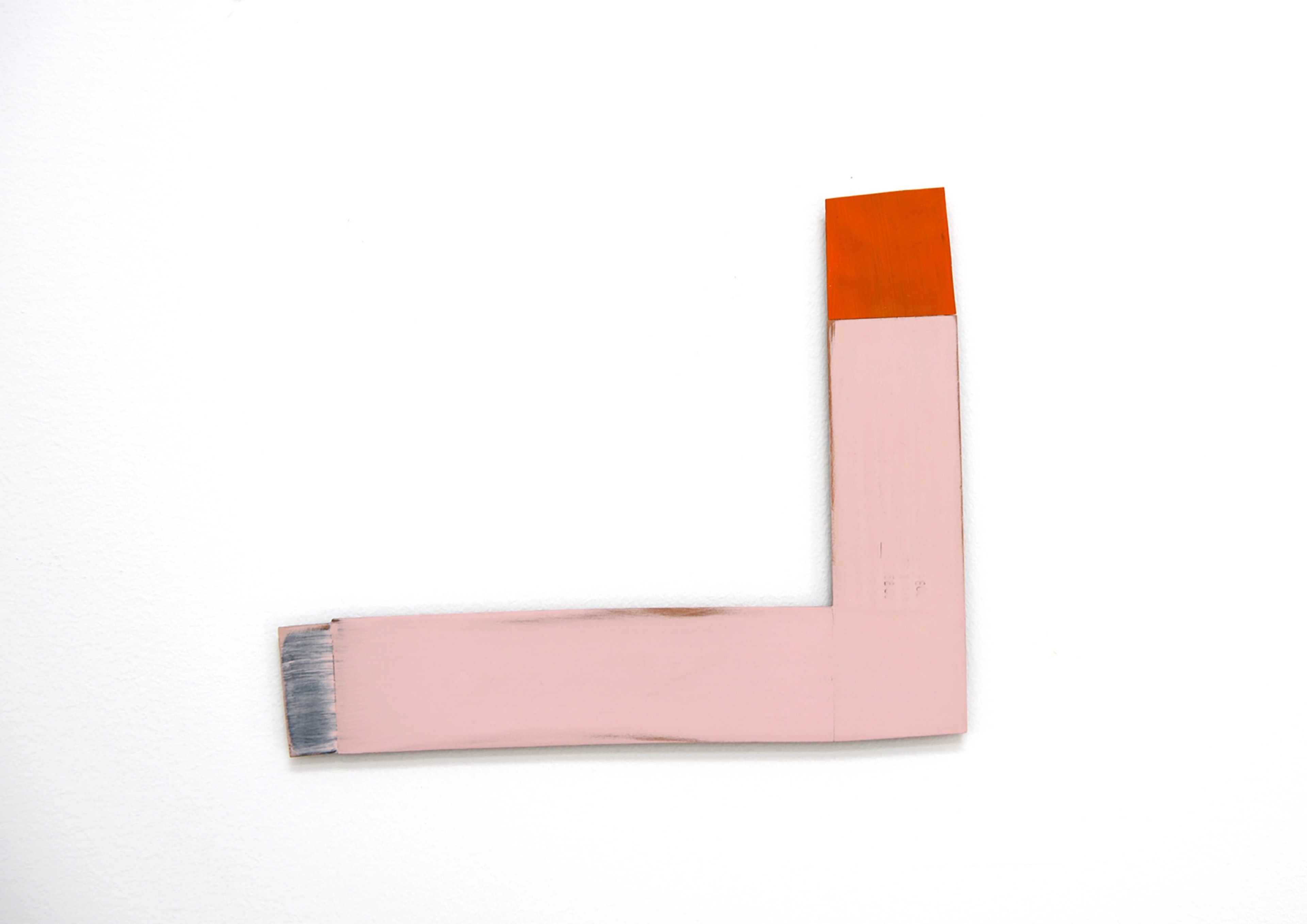 L-shaped wooden form painted pink with orange top section and blue brushstroke detail on left edge, against white background