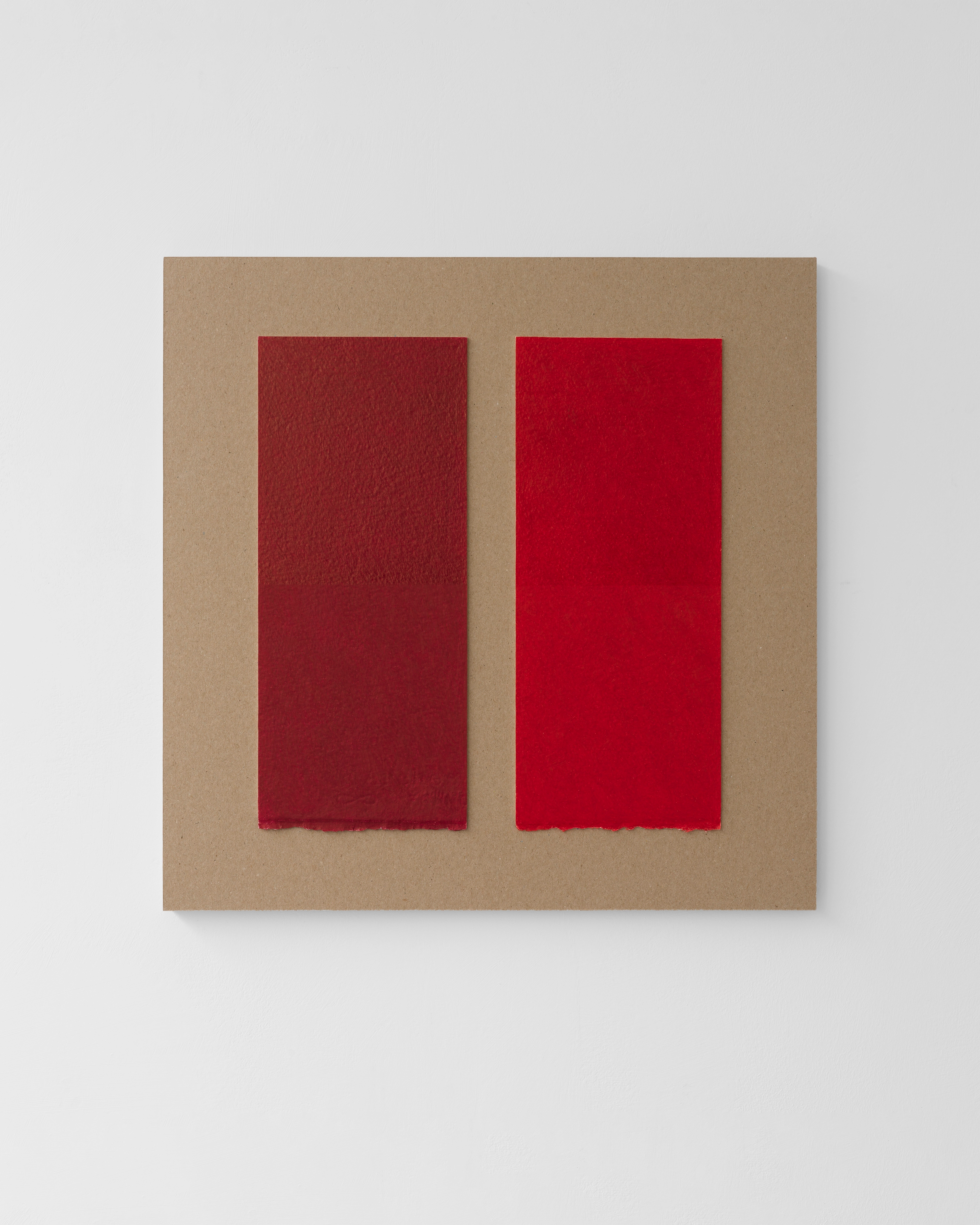 Tan plywood panel displaying two vertical rectangles in deep burgundy and bright red, rendered in wax pencil with soft, textured edges on a neutral background