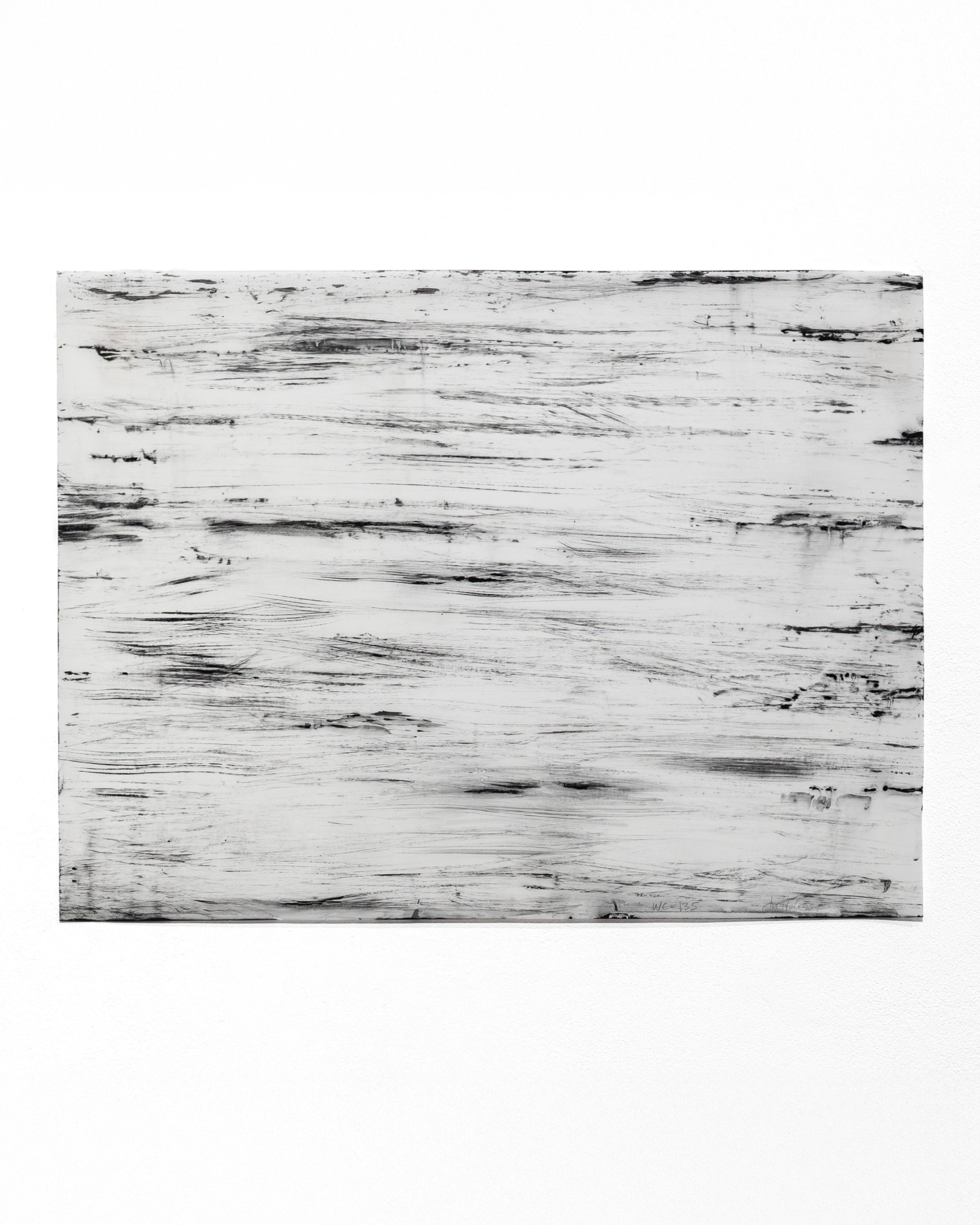 Horizontal watercolour composition with layered black gestural marks and streaks across a white surface, creating an abstract landscape-like effect of moveme…