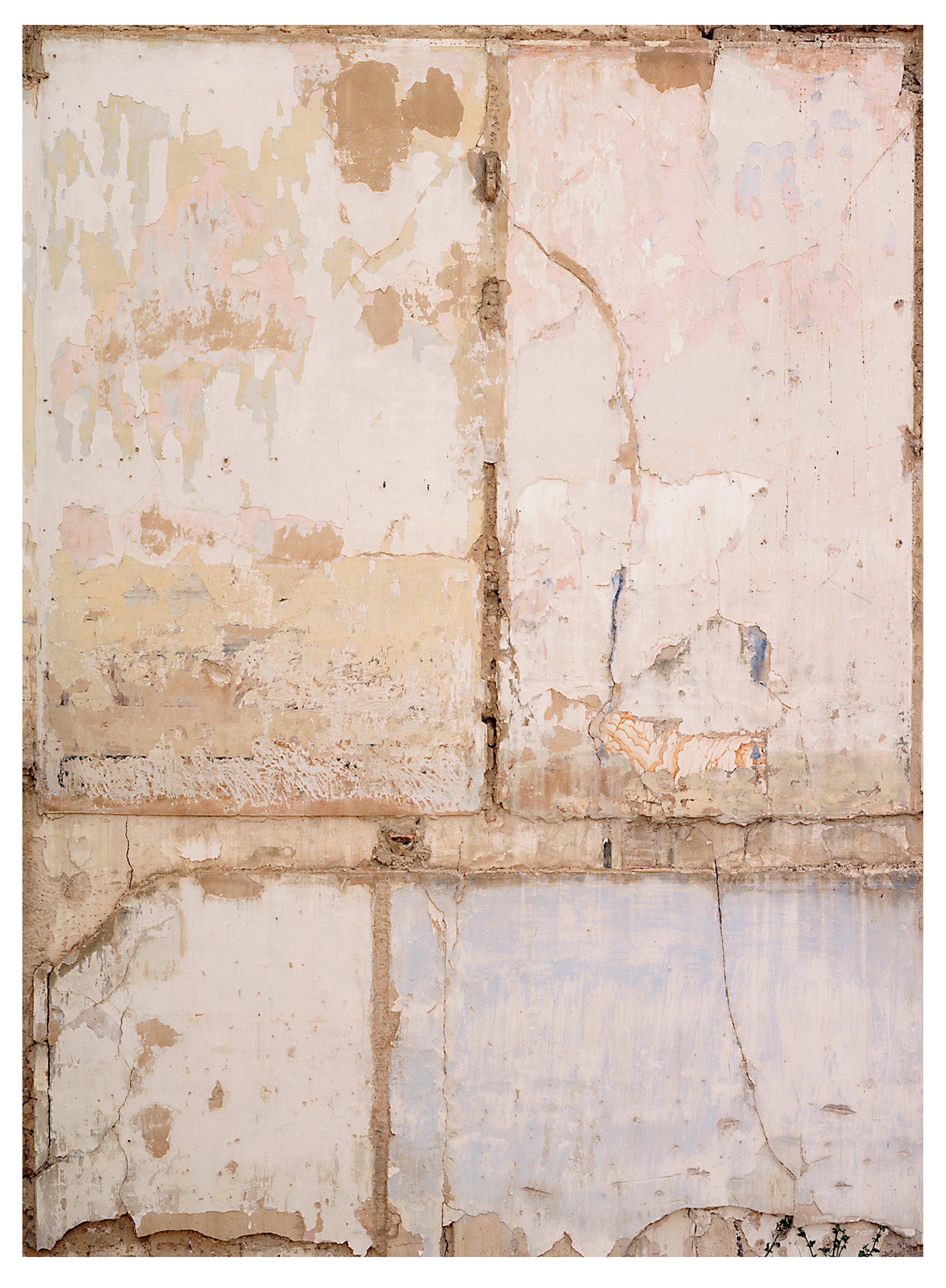 Weathered surface of four cream and beige painted panels divided by tan grout lines, showing peeling paint, stains, and cracks in muted ochre and dusty rose…