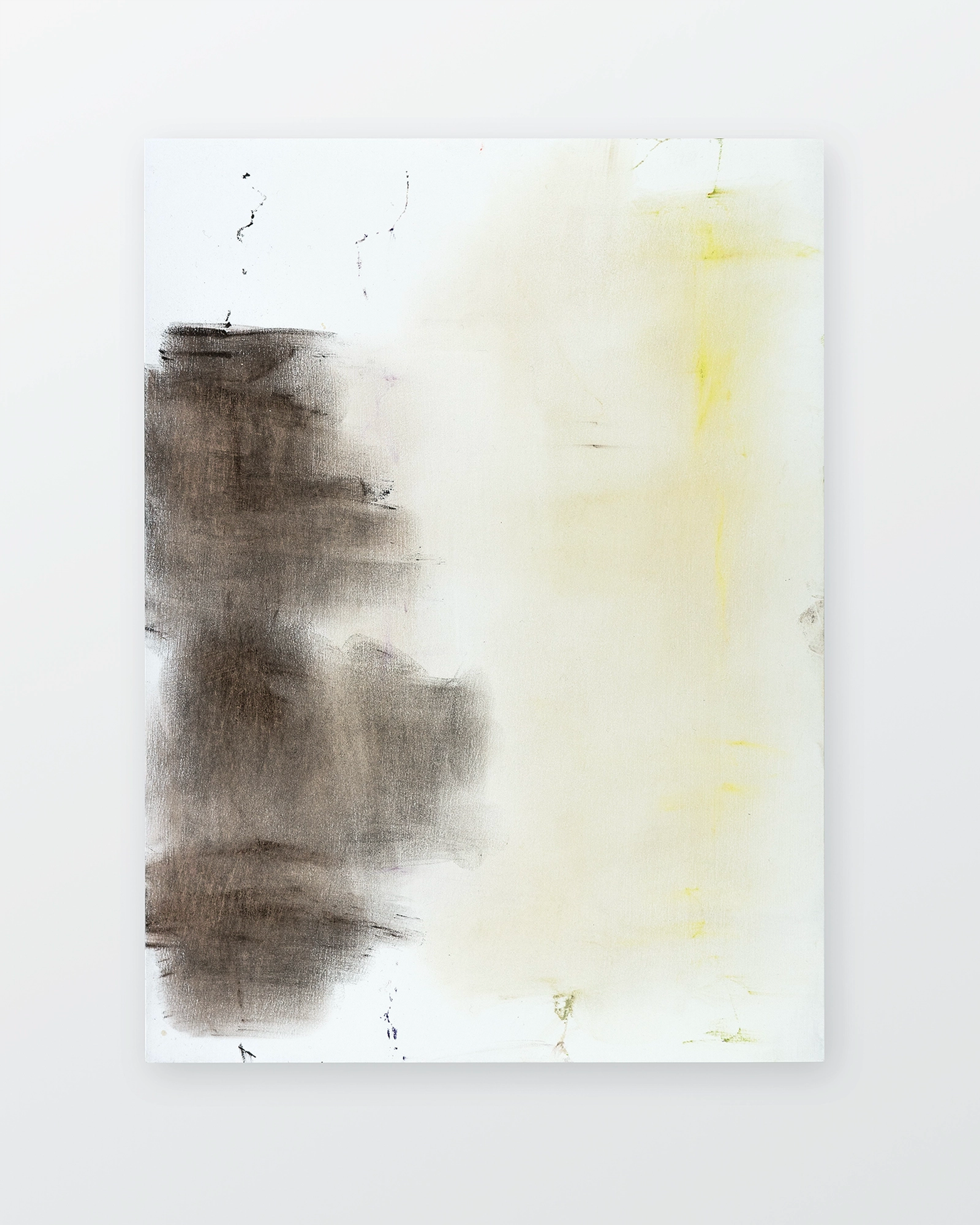 Vertical composition with dense charcoal-grey smudged forms on left side contrasting against pale cream and yellow washes on right, with scattered linear mar…