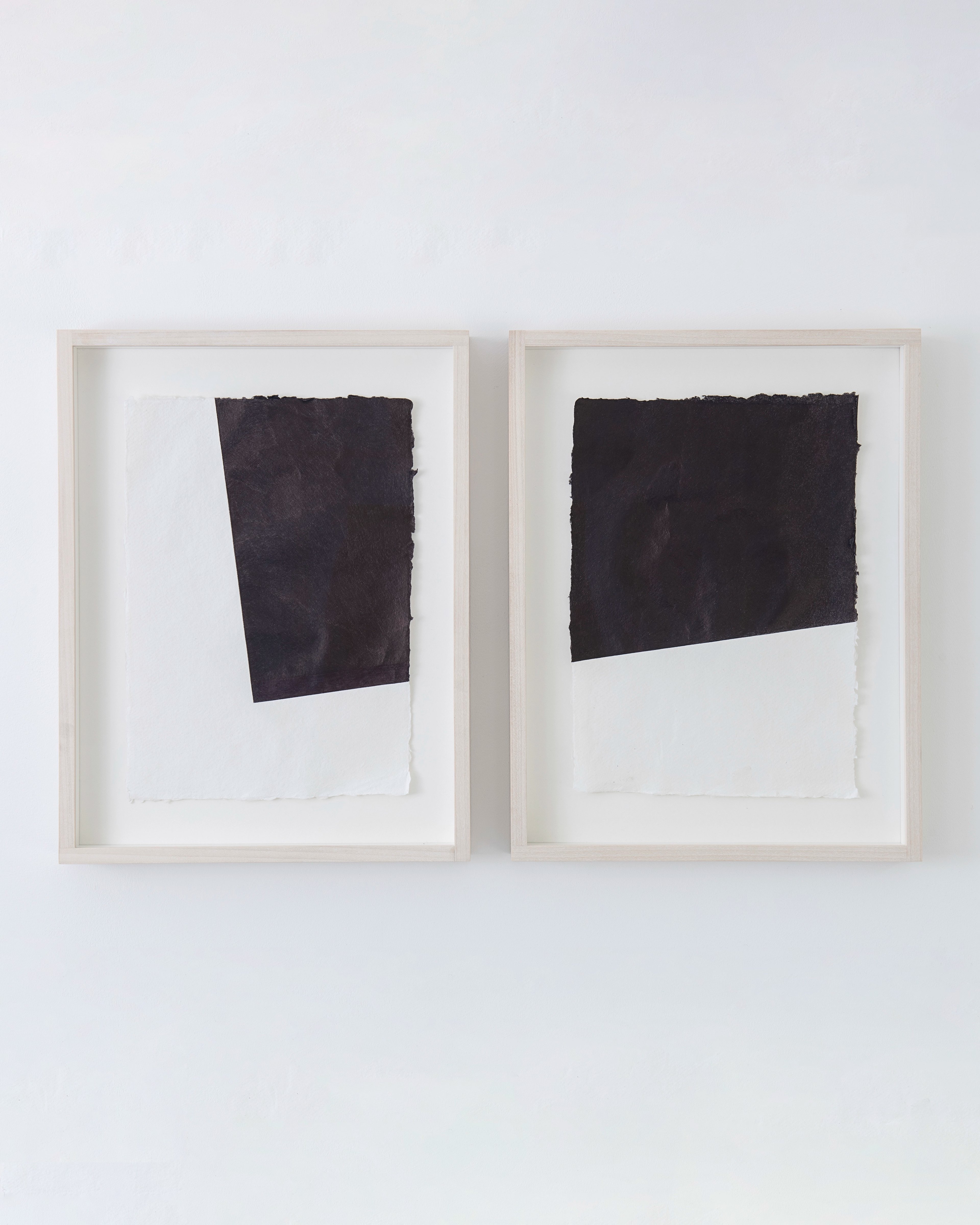 Diptych of two framed works on paper, each featuring a black rectangular form drawn with biro on white ground, positioned at slightly different angles within…