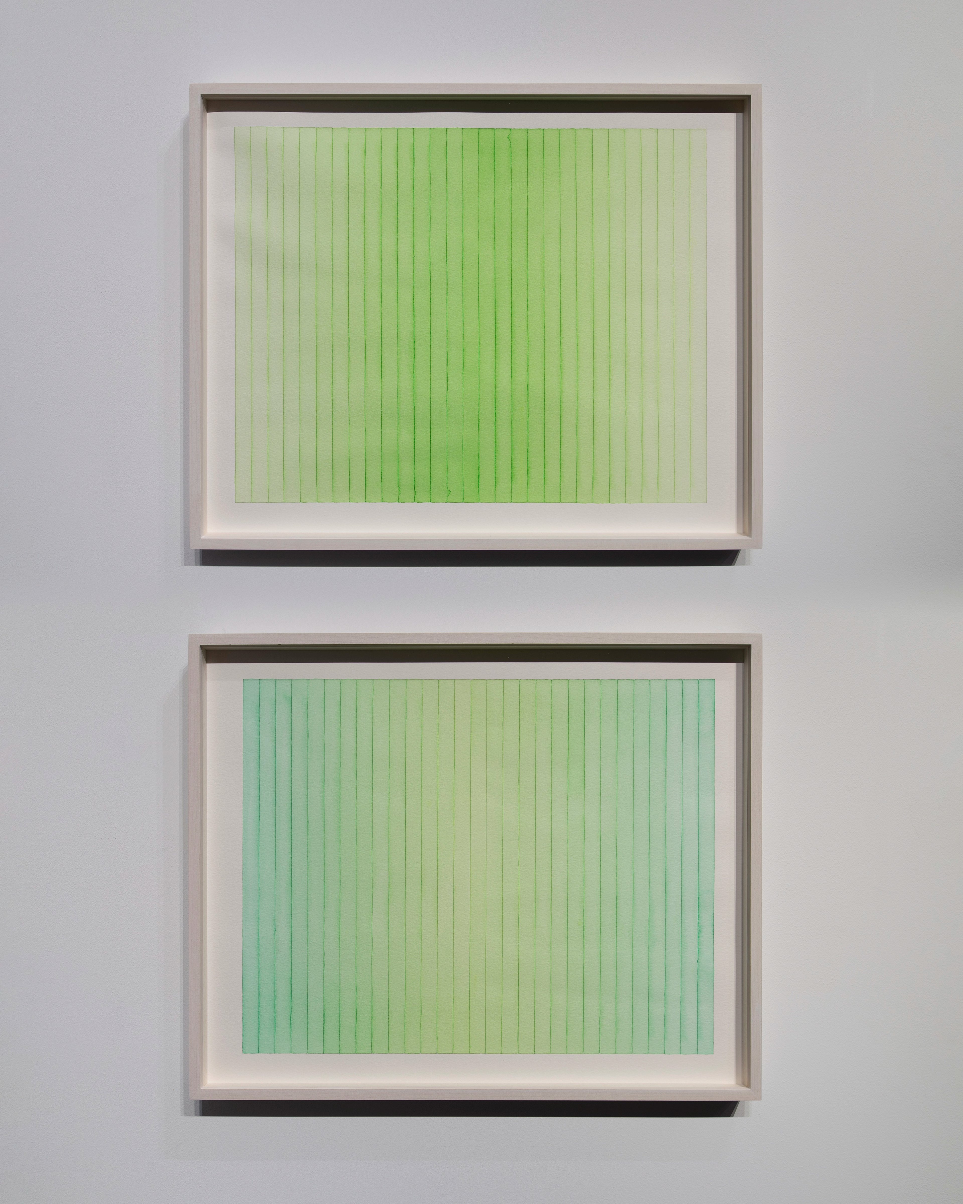Two framed watercolour works on paper with vertical striations: upper panel in bright lime green, lower in soft mint-to-sage green gradient, mounted with whi…