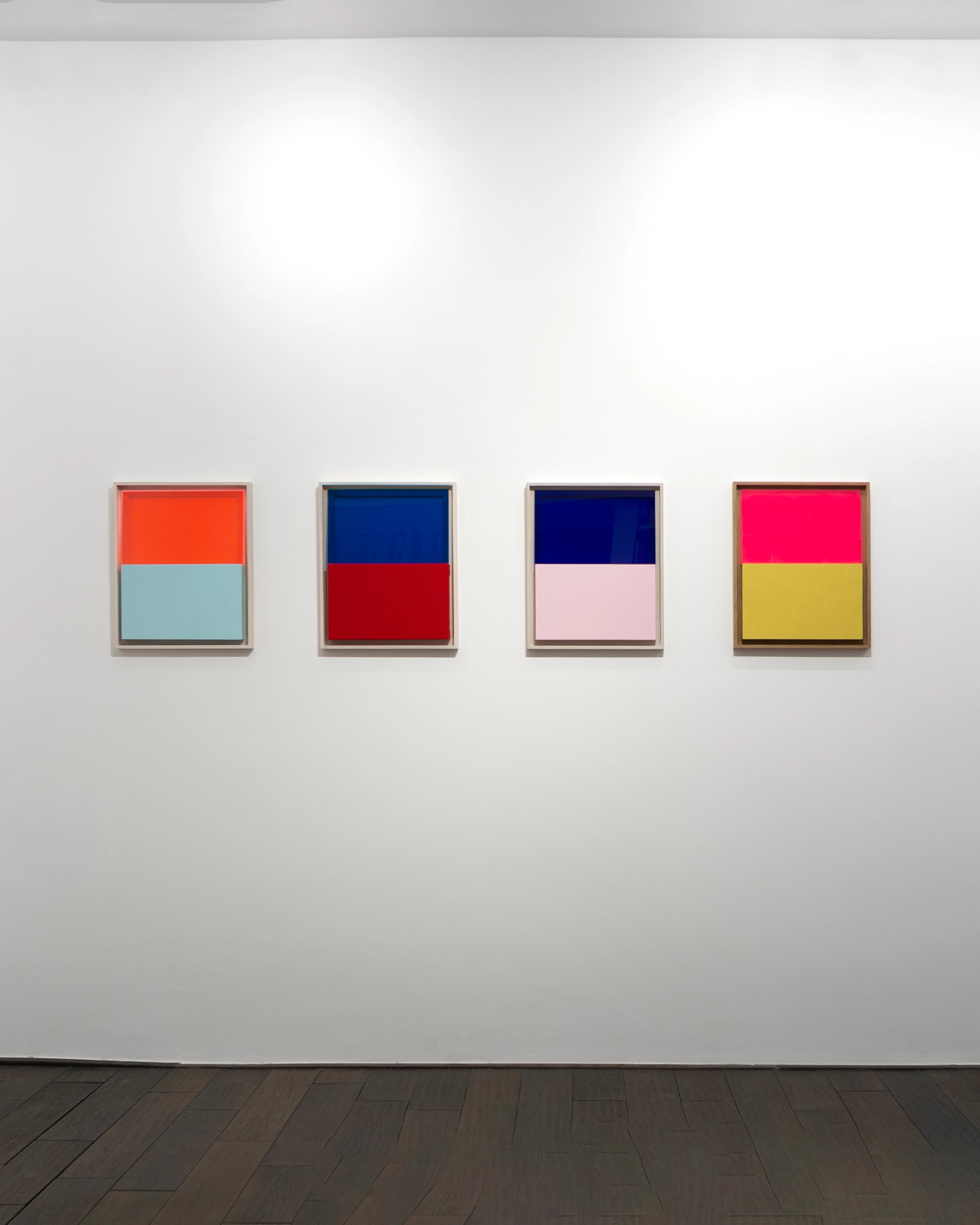 Four framed panels with horizontal colour divisions: orange over light blue, navy over red, dark navy over pale pink, and hot pink over mustard yellow