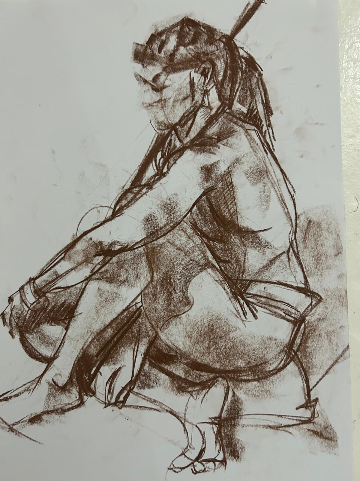 "Charcoal life drawing sketch of a seated figure with dreadlocks, shown in profile. The expressive study captures posture, shading, and line work, created during a life drawing session at Brixton Warehouse."