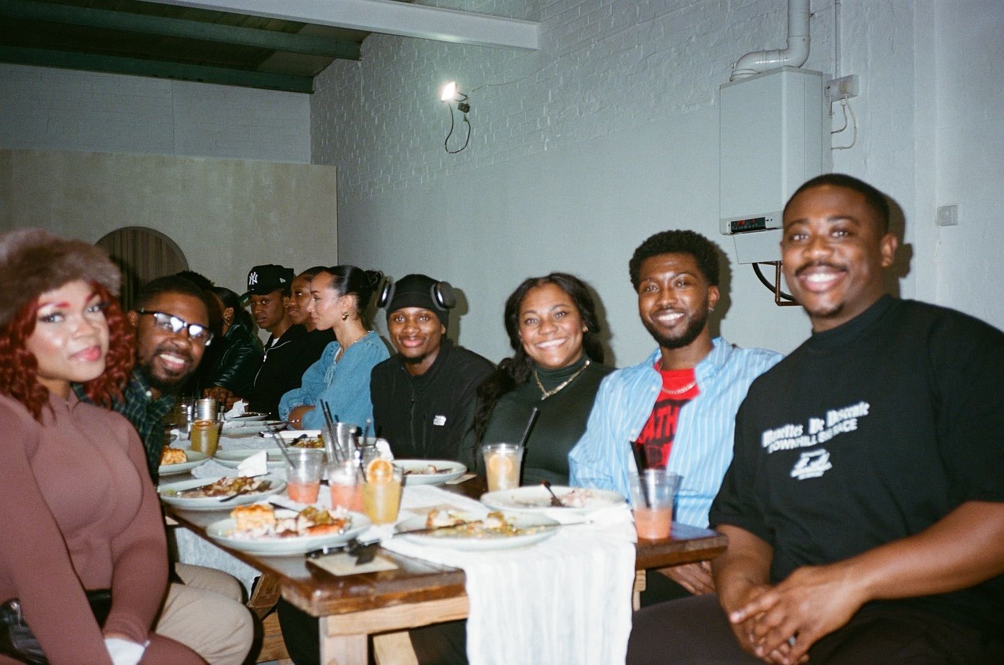 Thanksgiving dinner at Brixton Warehouse – a vibrant gathering of friends enjoying a festive meal in an industrial-chic event space. Warm lighting, communal dining, and a welcoming atmosphere make this the perfect venue for private dining, celebrations, and social events in London.