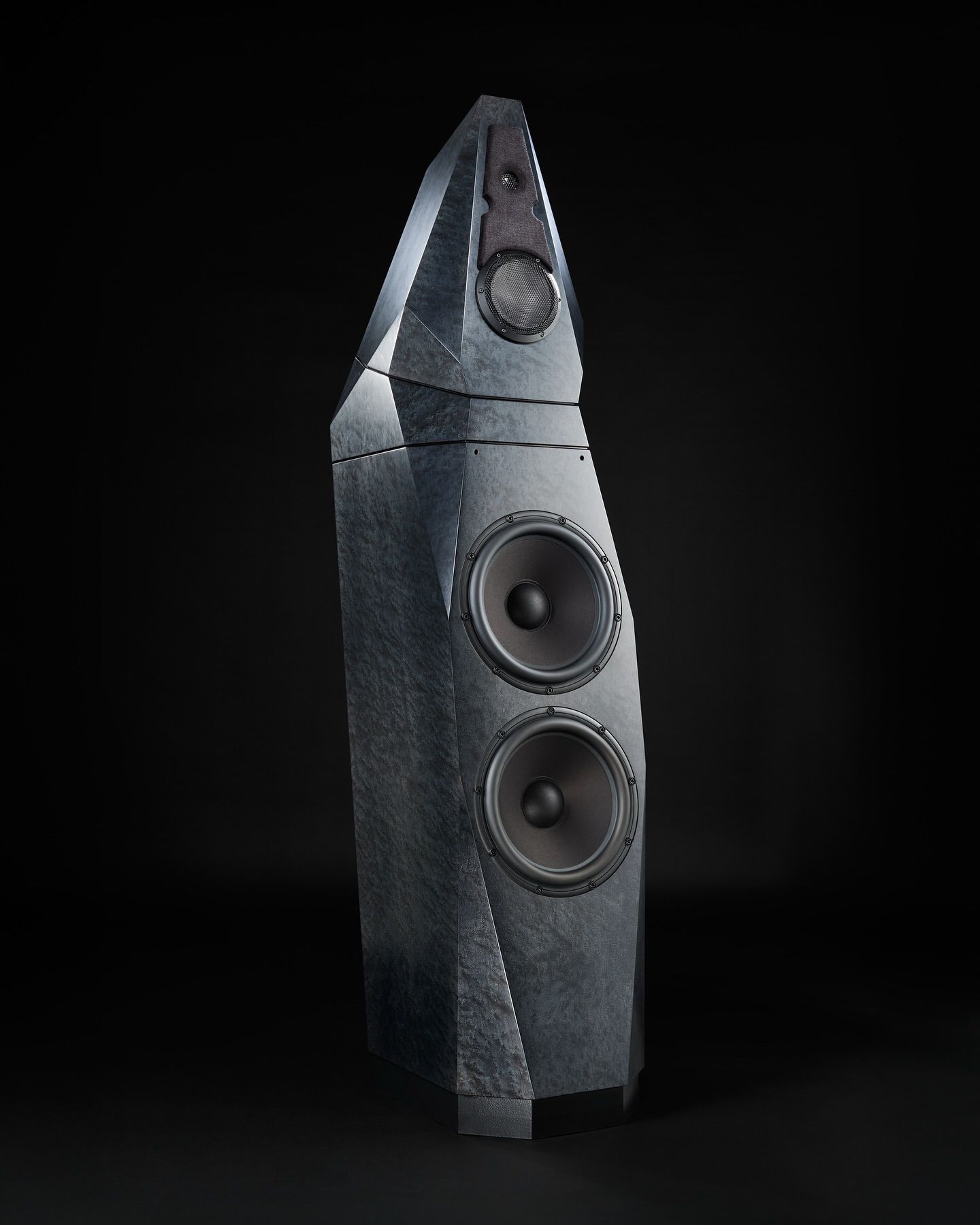 Three modern tech speakers on a black backdrop, minimalist and contemporary styling.