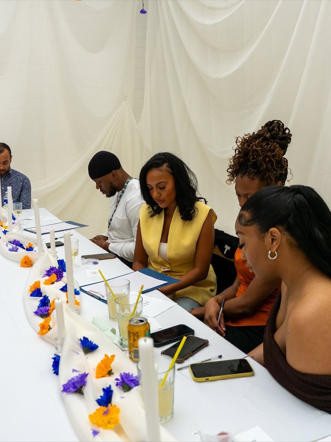 People at supper party engaging in an activity