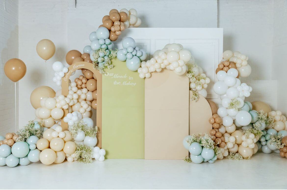 “Elegant balloon installation in soft neutrals and pastels at Brixton Warehouse, styled for a special event backdrop.”