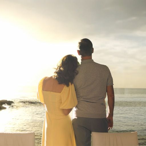 Couple watching the Mediterranean sunset from a luxury seaside home in Cyprus.
