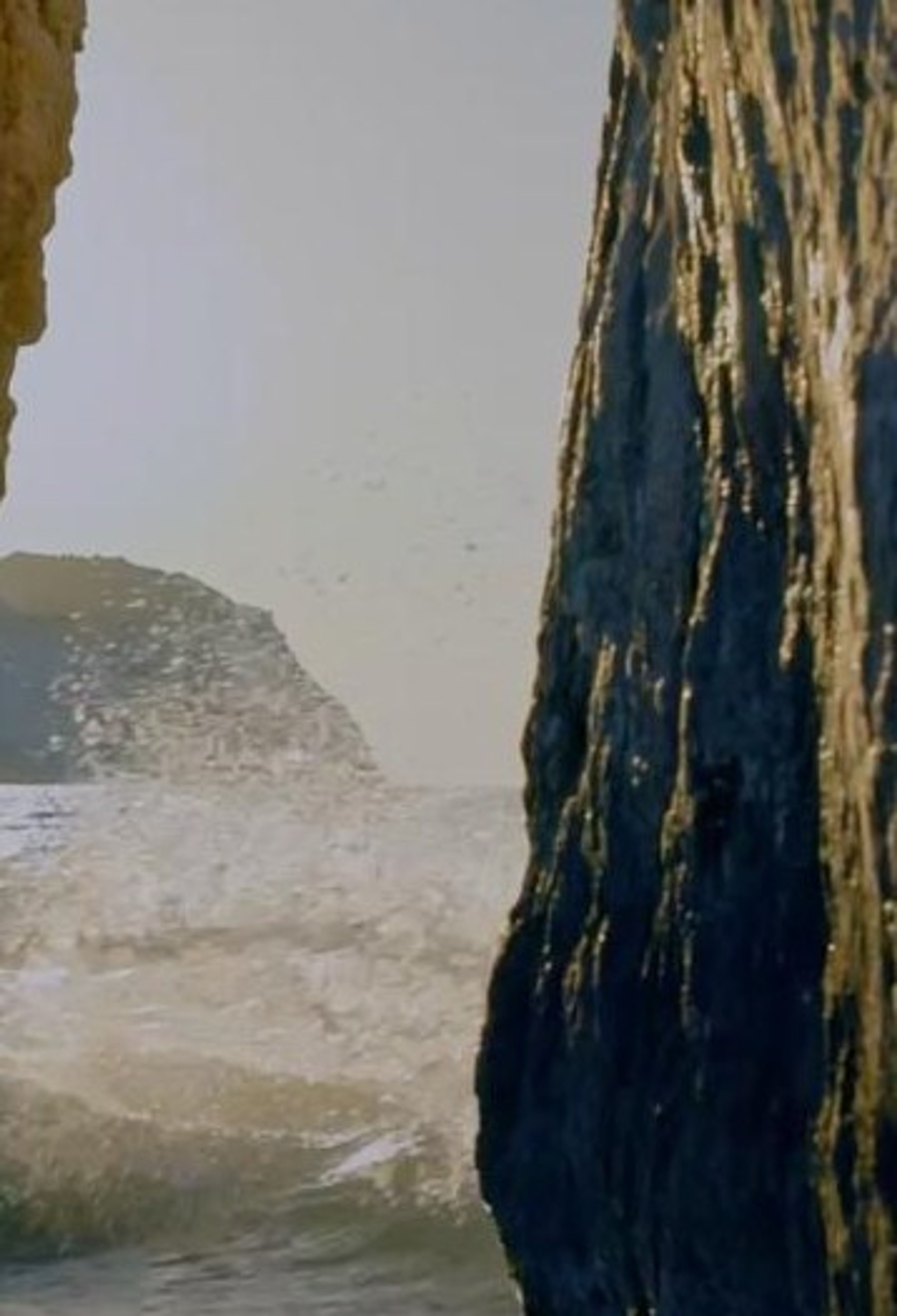 Waves breaking against a sea rock
