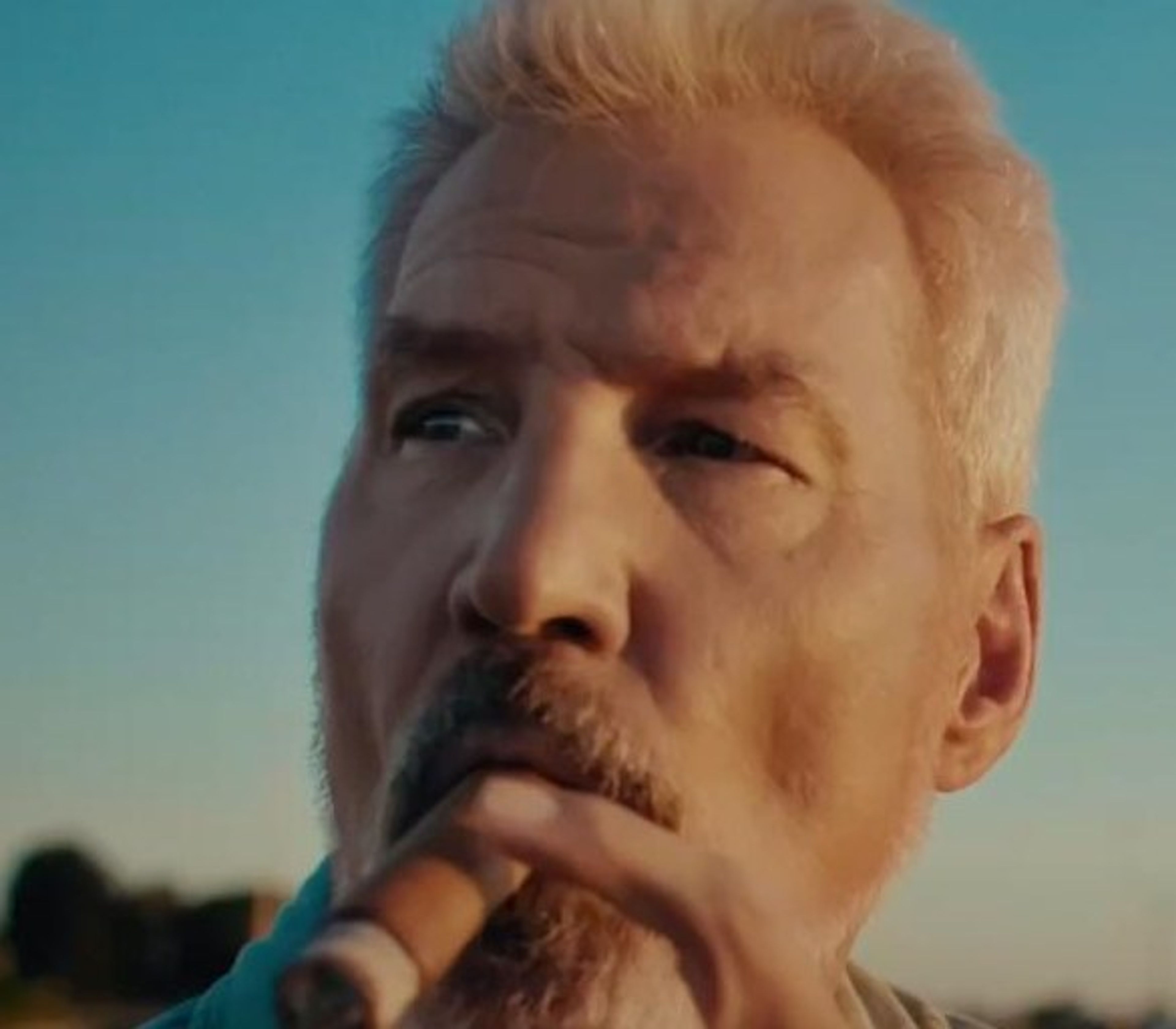 Man with a cigar at golden hour