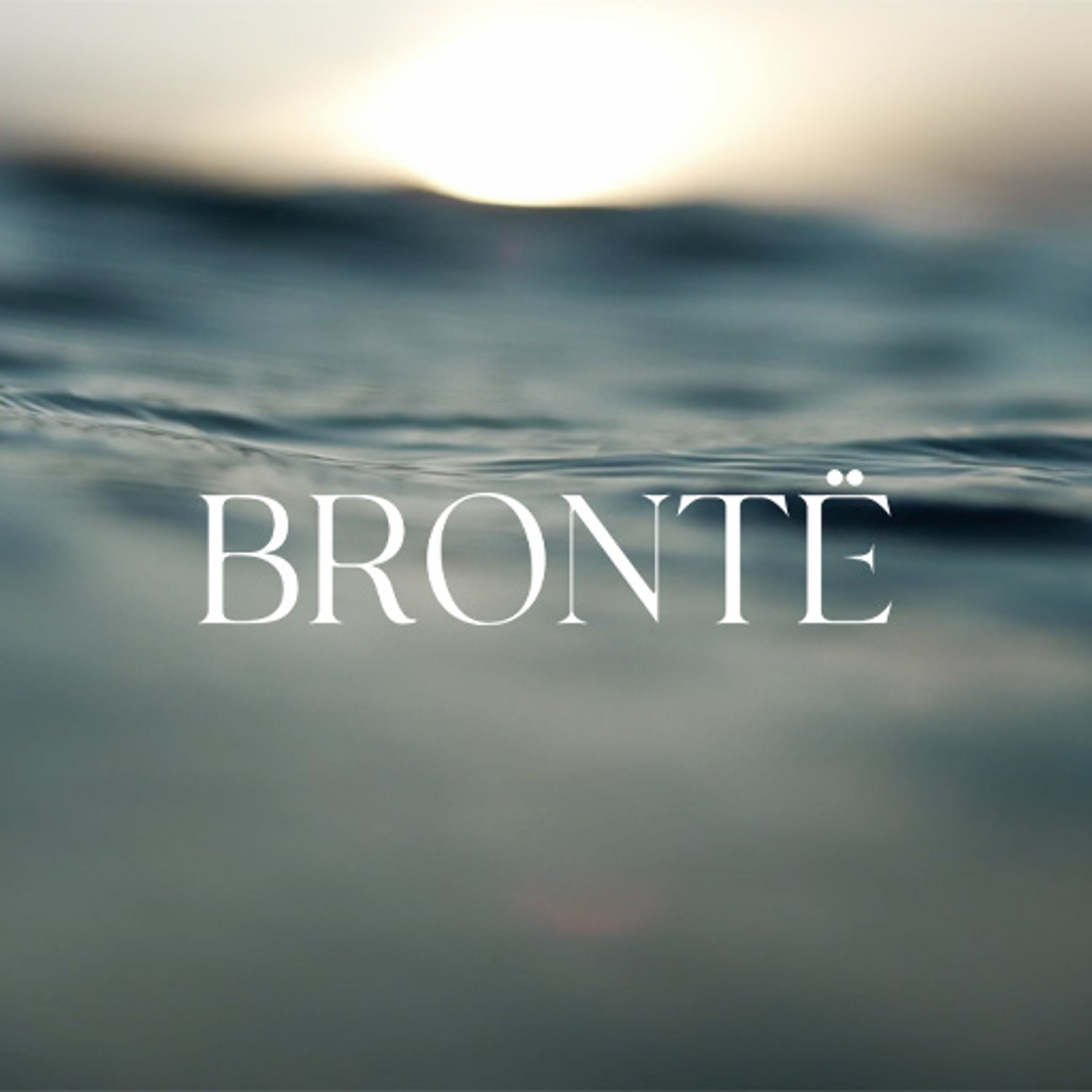 BRONTË wordmark over a close-up view of the sea at sunset.