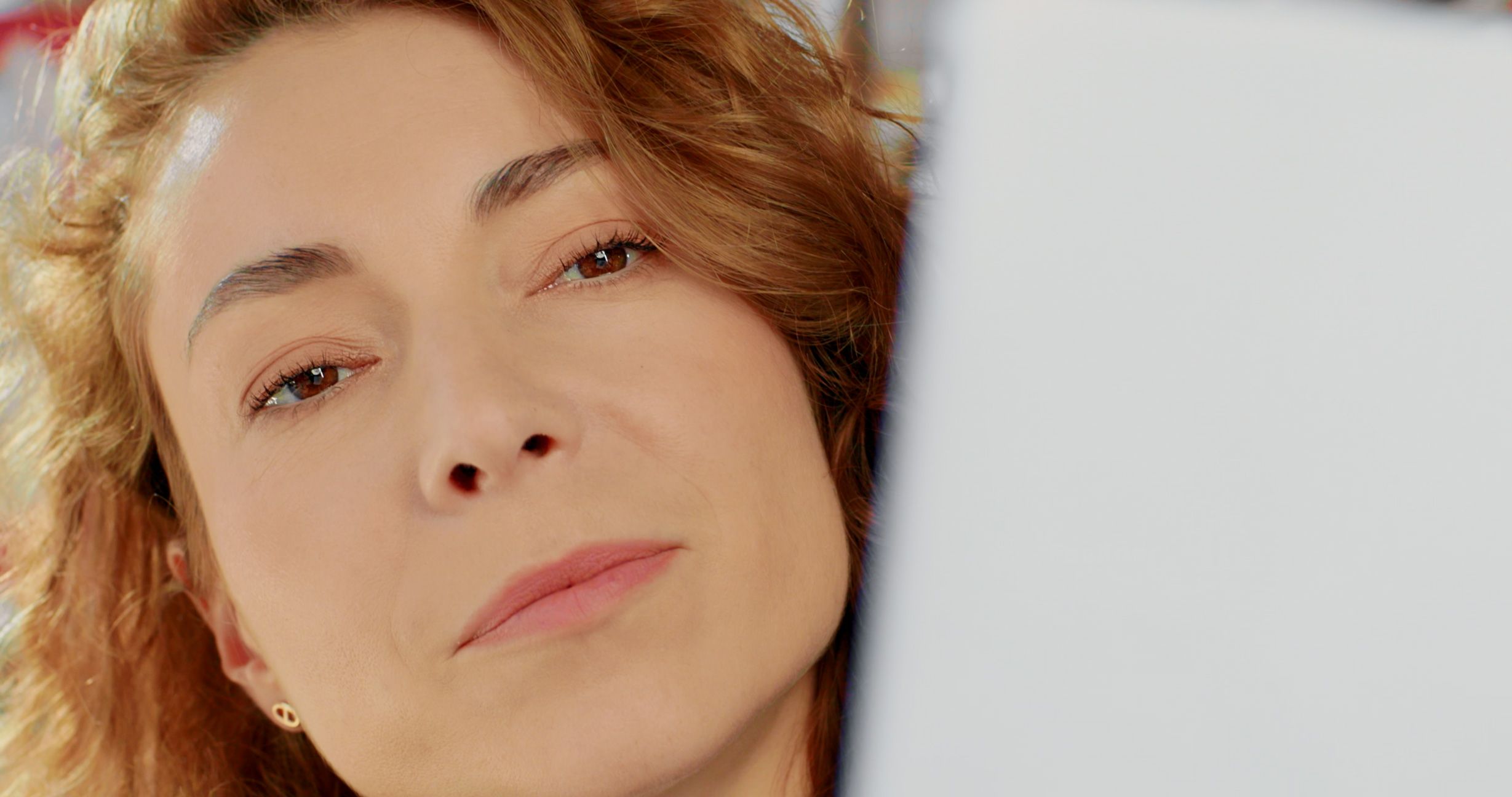 Close-up of Nataly Bolshakova studying a Belle Air design