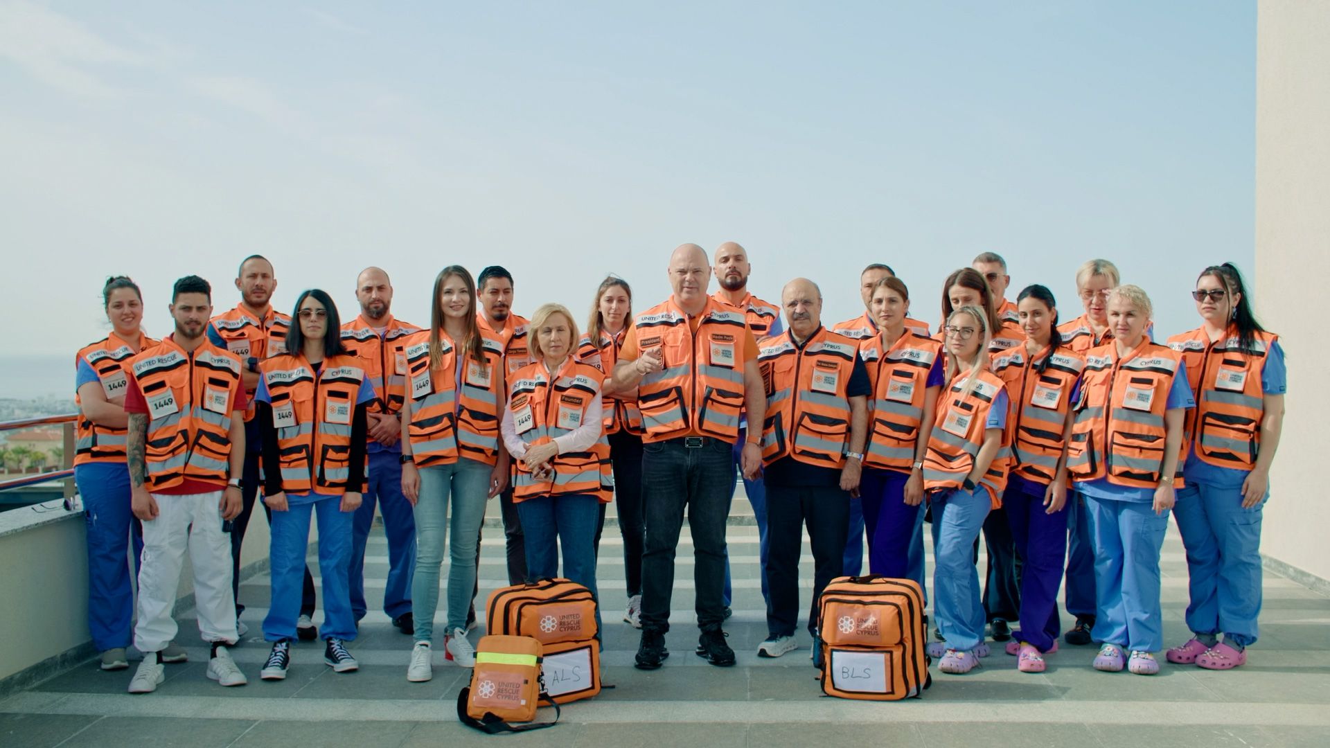 Group of United Rescue Cyprus volunteers standing together with emergency medical bags.