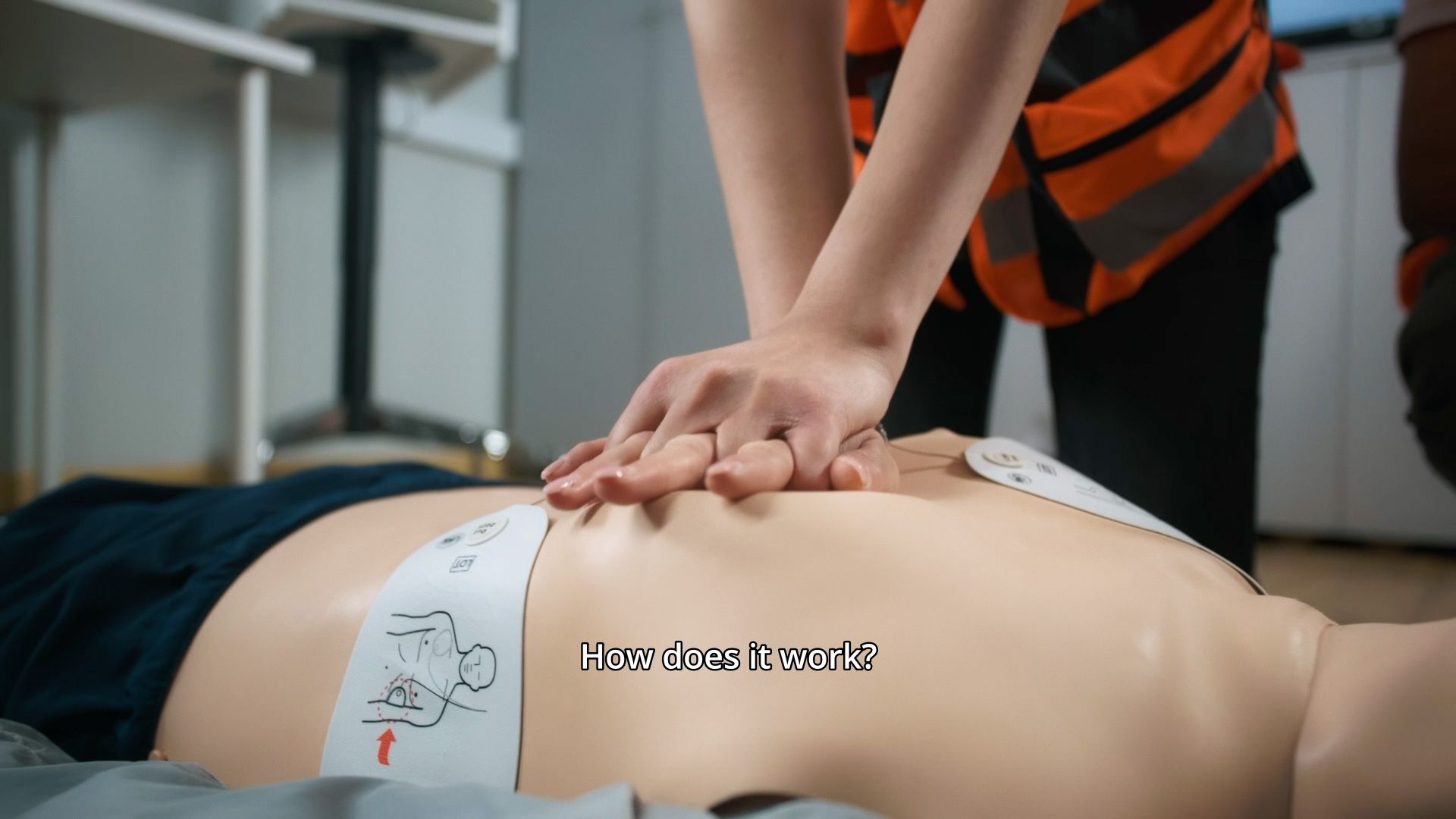 United Rescue Cyprus volunteer performing CPR chest compressions on a training manikin.