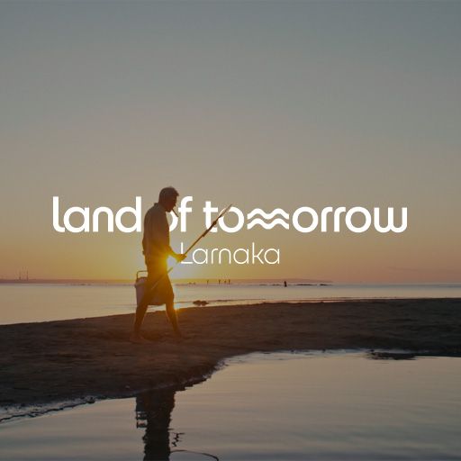 Older man with a cigar in warm sunlight during the Land of Tomorrow lifestyle campaign