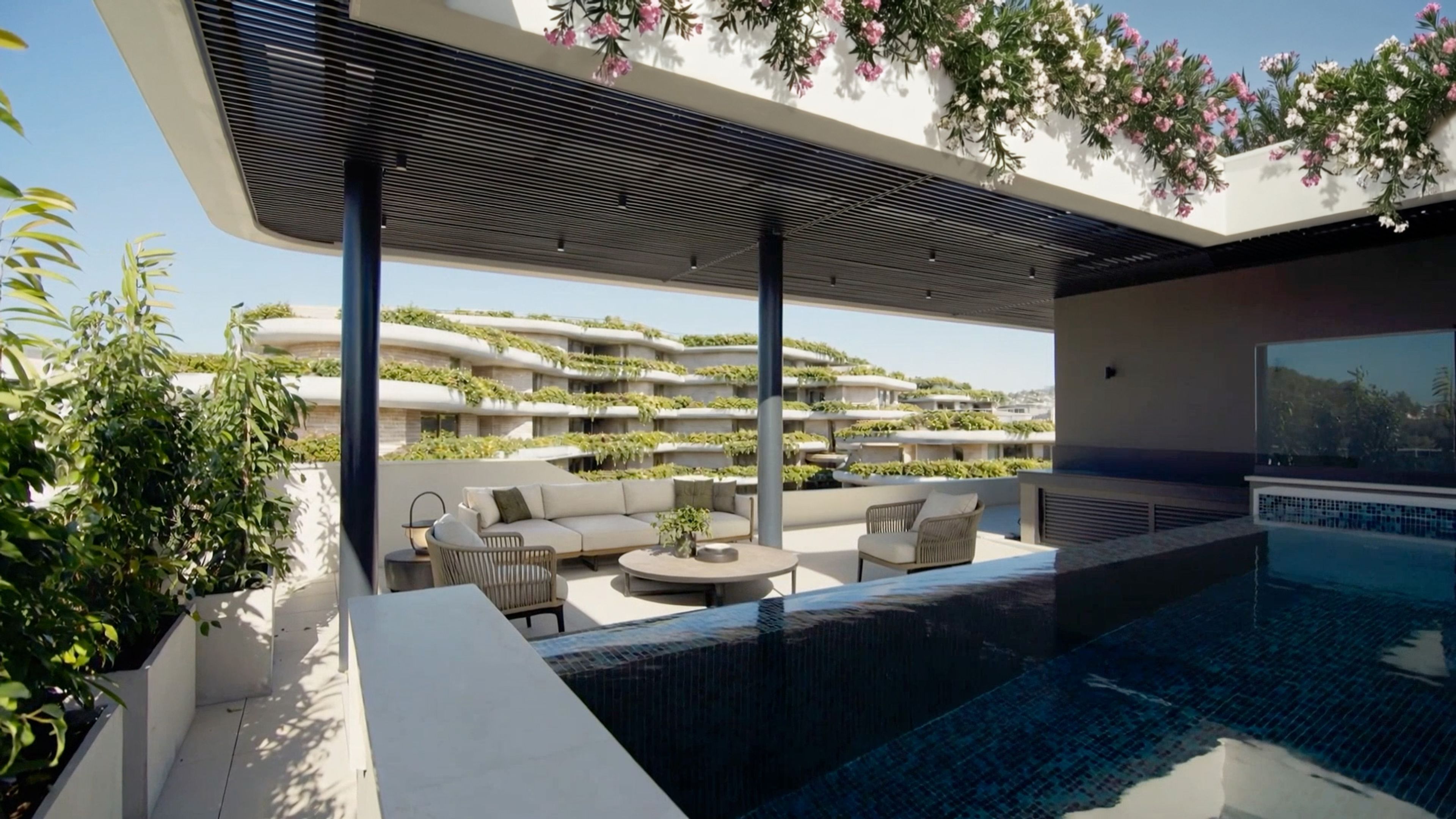 Private terrace with a pool overlooking the landscaped Land of Tomorrow buildings