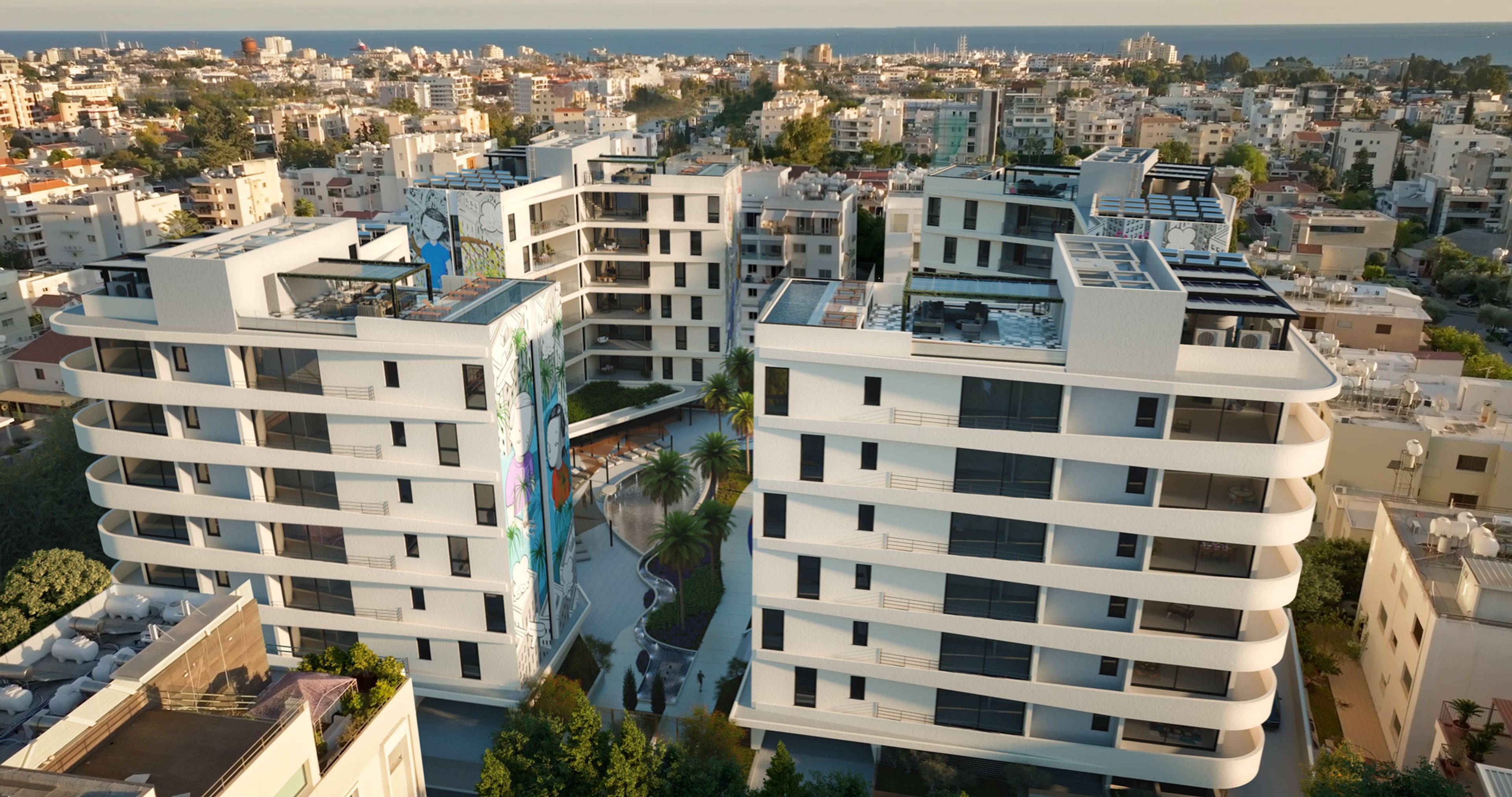 Aerial view of the four Art Square residential blocks placed into the real Limassol cityscape.