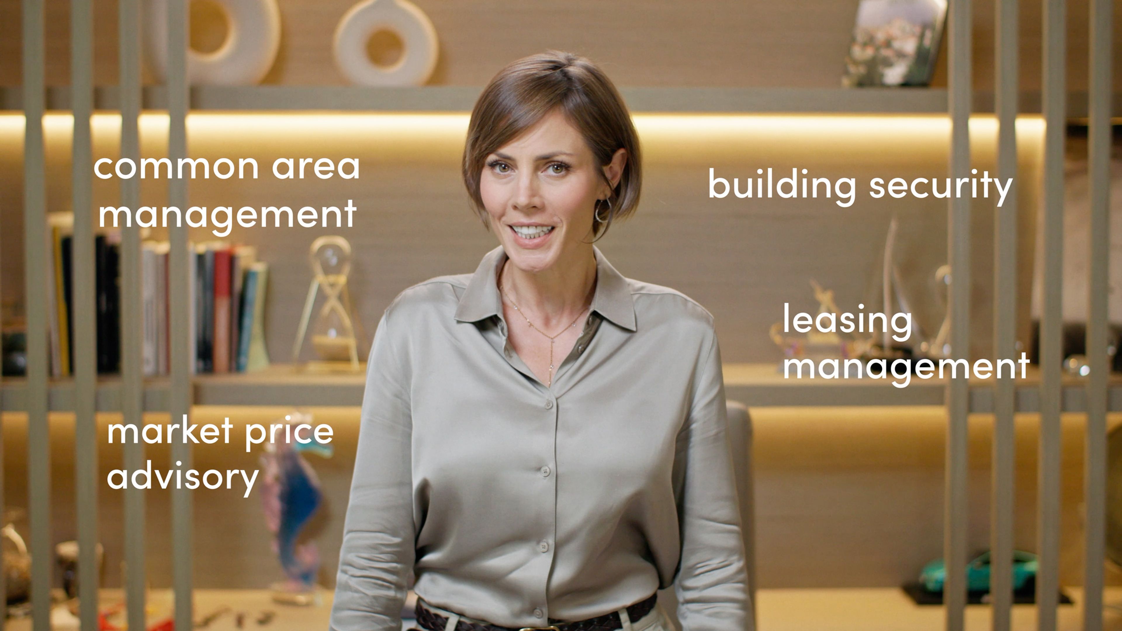 Presenter explaining commercial building services with animated text on screen.