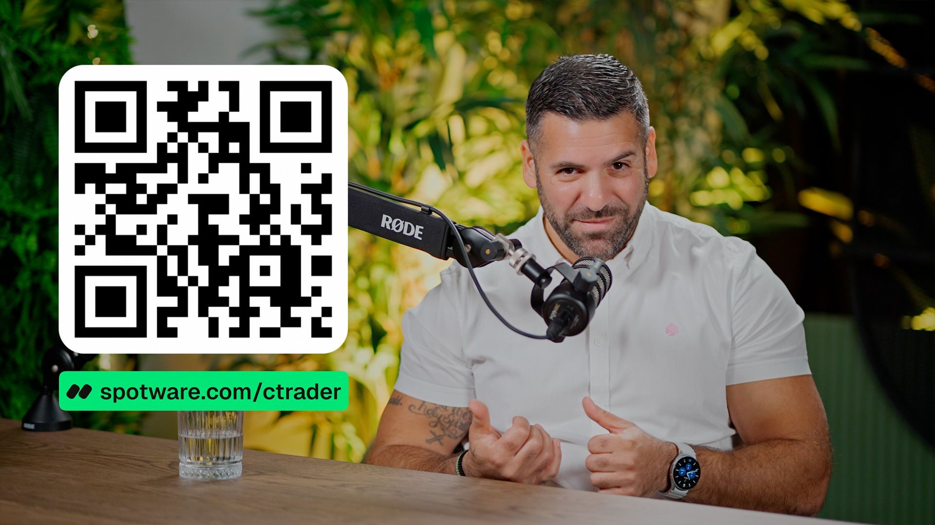 Podcast host speaking beside a QR code linking to Spotware’s cTrader website.