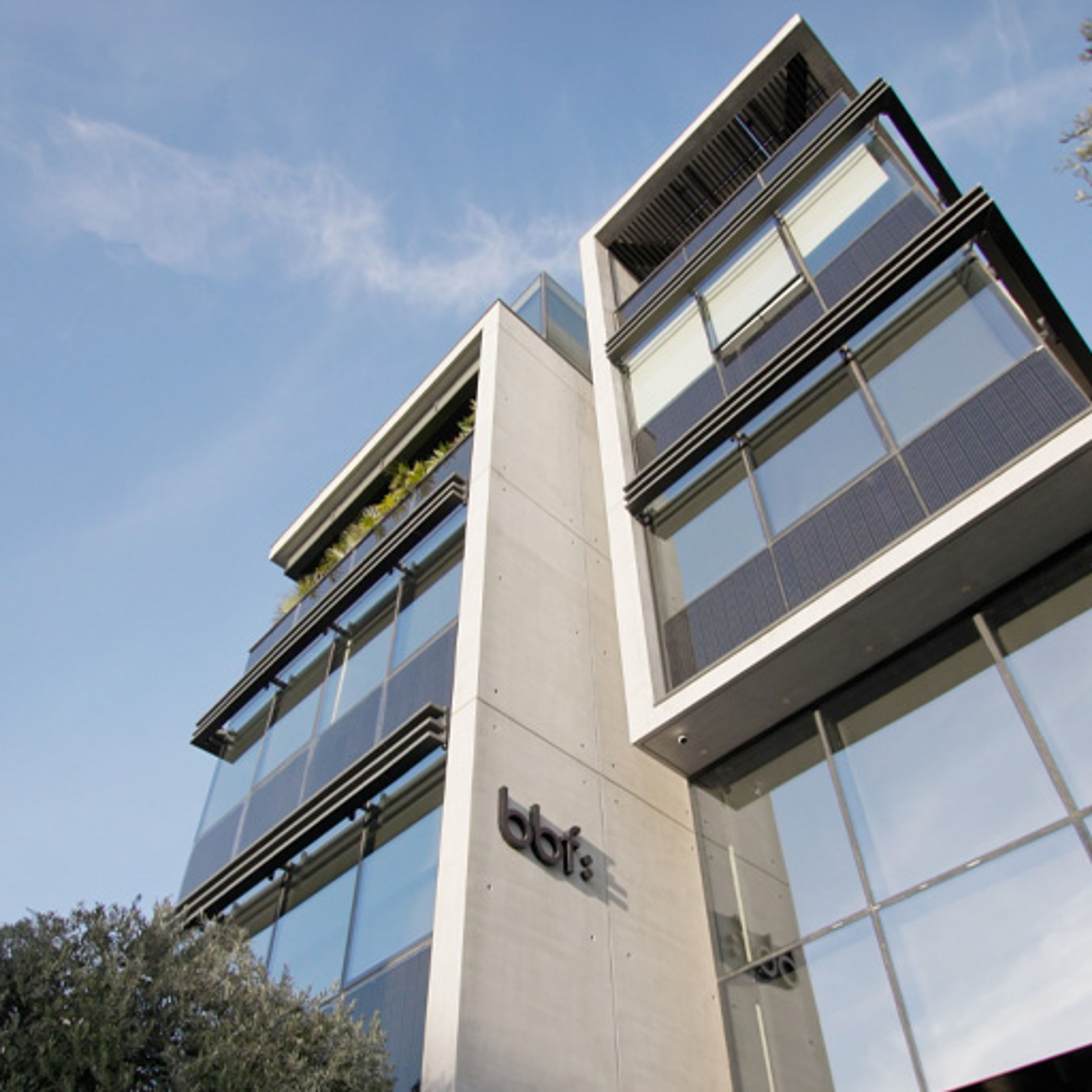 Low-angle view of a modern bbf: commercial office building in Limassol, Cyprus.