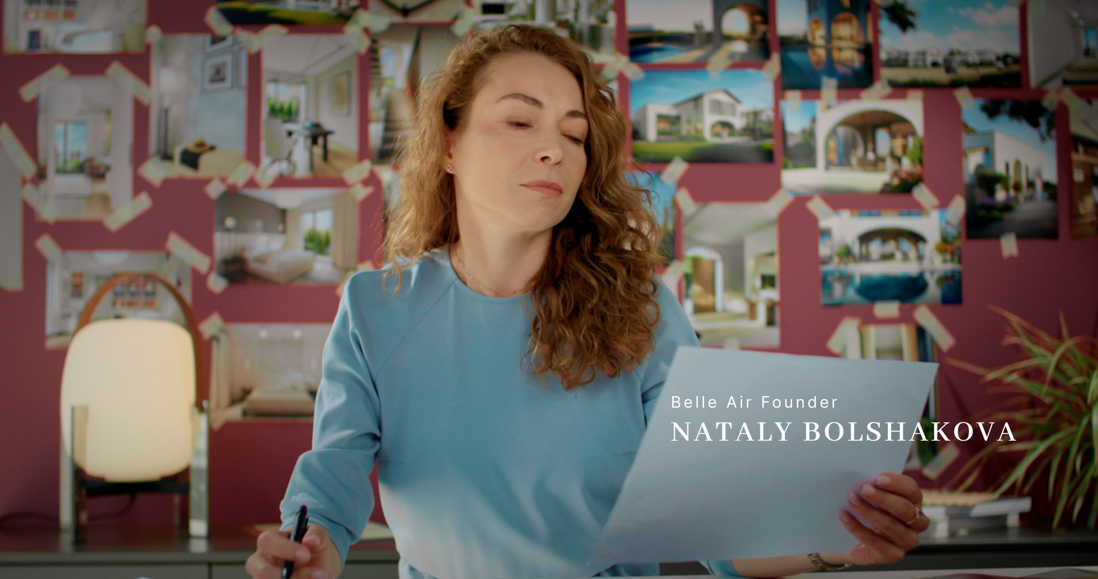Belle Air founder Nataly Bolshakova reviewing a design sheet in her studio