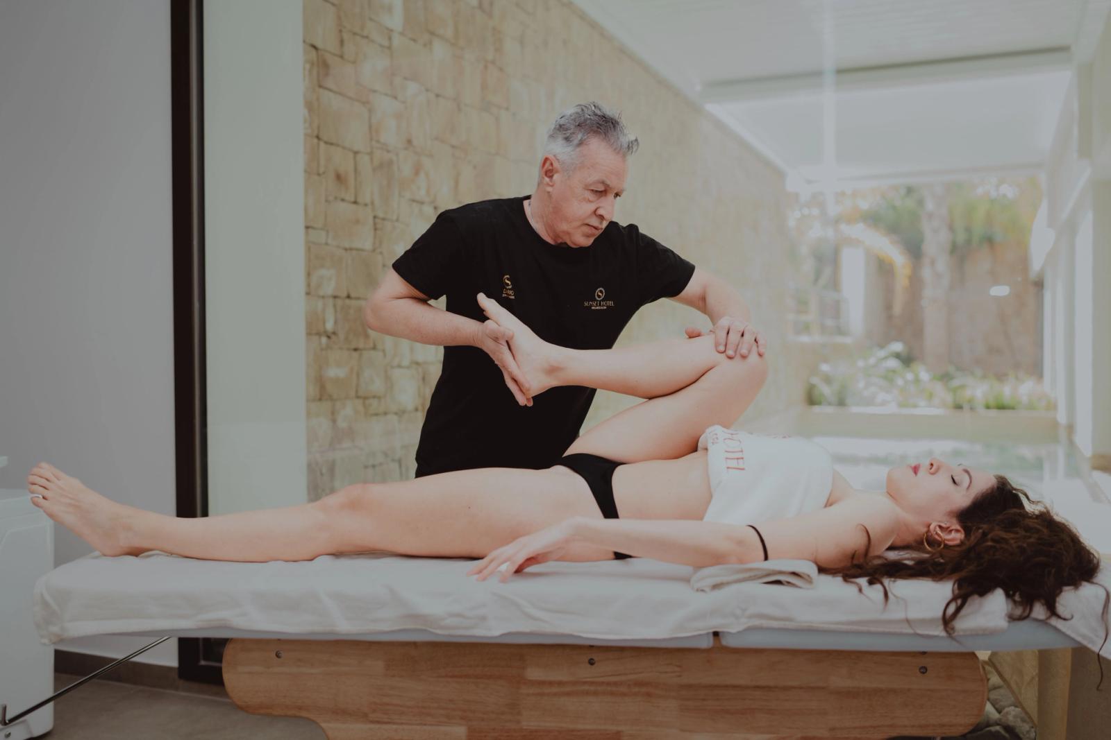Physical therapist assisting a patient during a rehabilitation session in a clinic