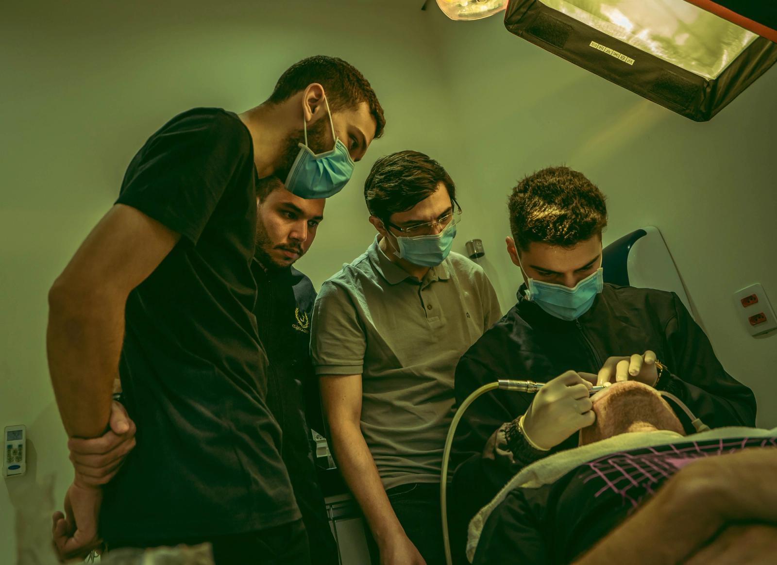 Dental team reviewing work together in a clinic