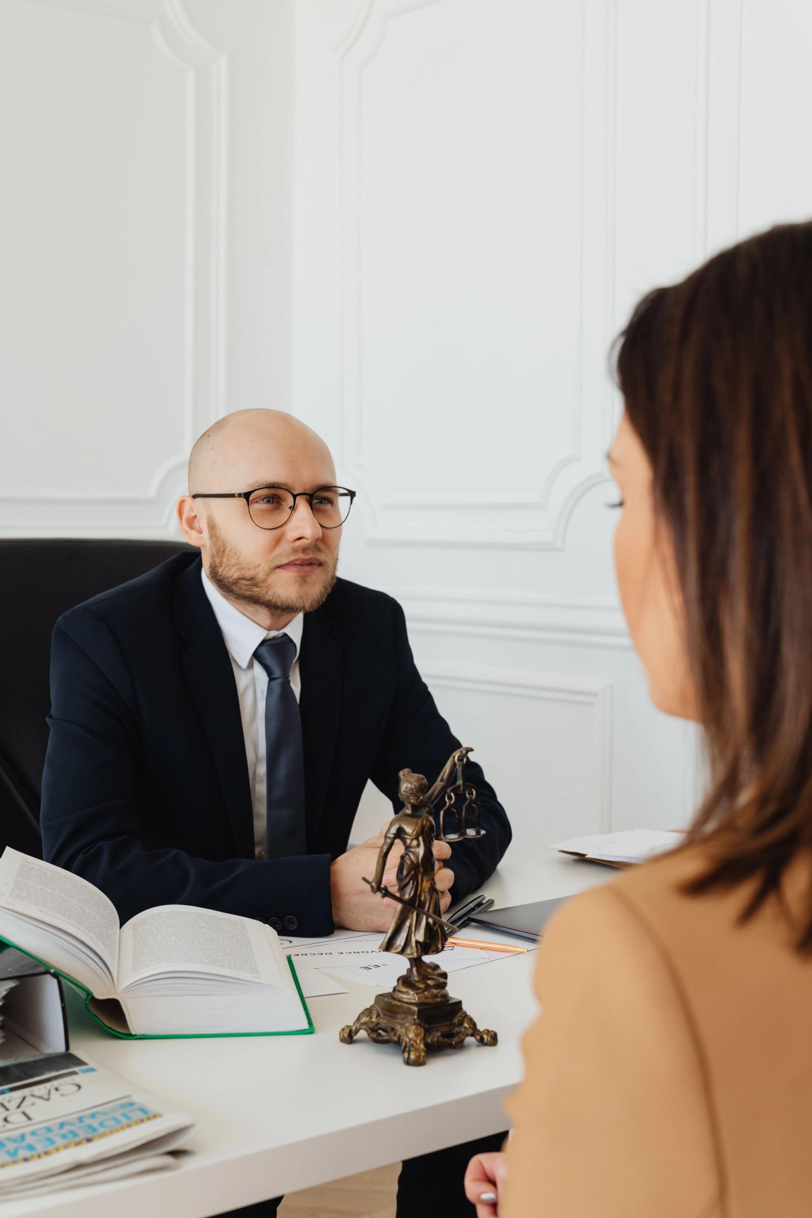 Lawyer consulting with a prospective client in a modern law office
