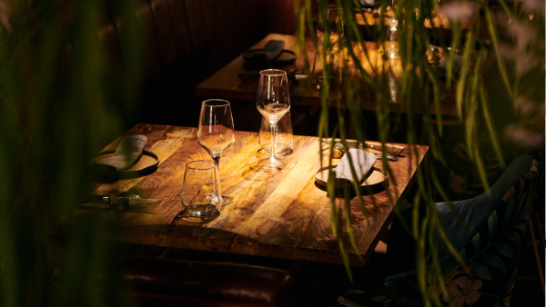 Guests enjoying an evening on the terrace of Carnal restaurant on Enric Granados street in Barcelona
