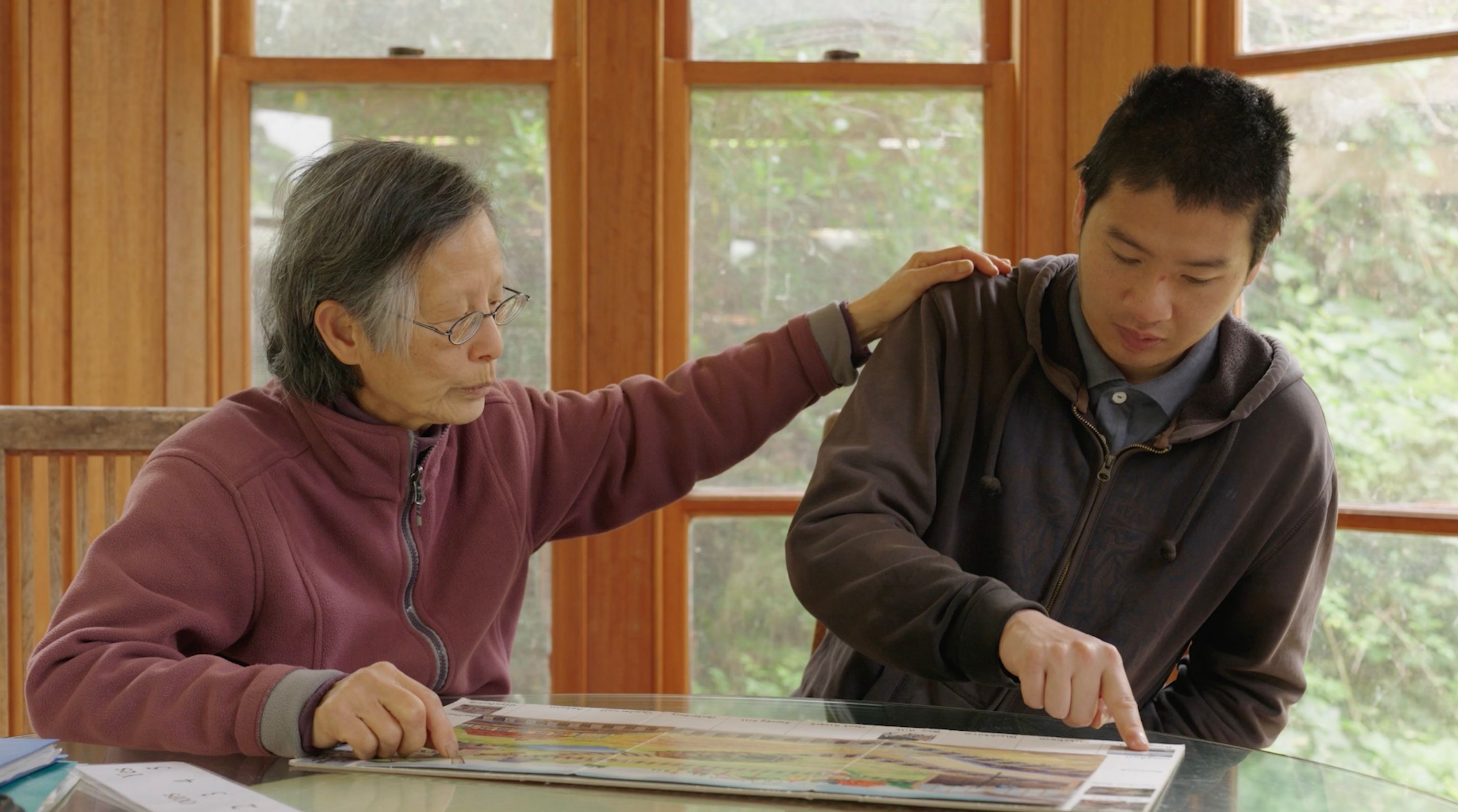 Sarah putting her hand on Tim's shoulder