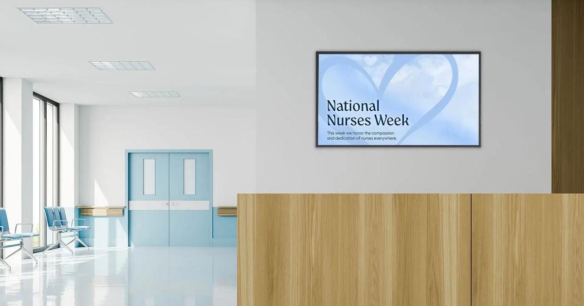 A digitally made hospital hallway with a screen displaying an Arreya monthly graphic for National Nurses Week.