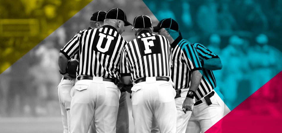 Photos of umpires in a huddle