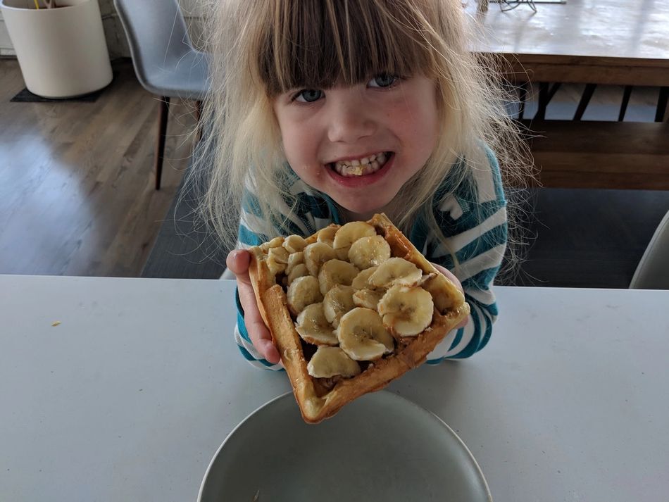 Kid eating amazing belgian waffles