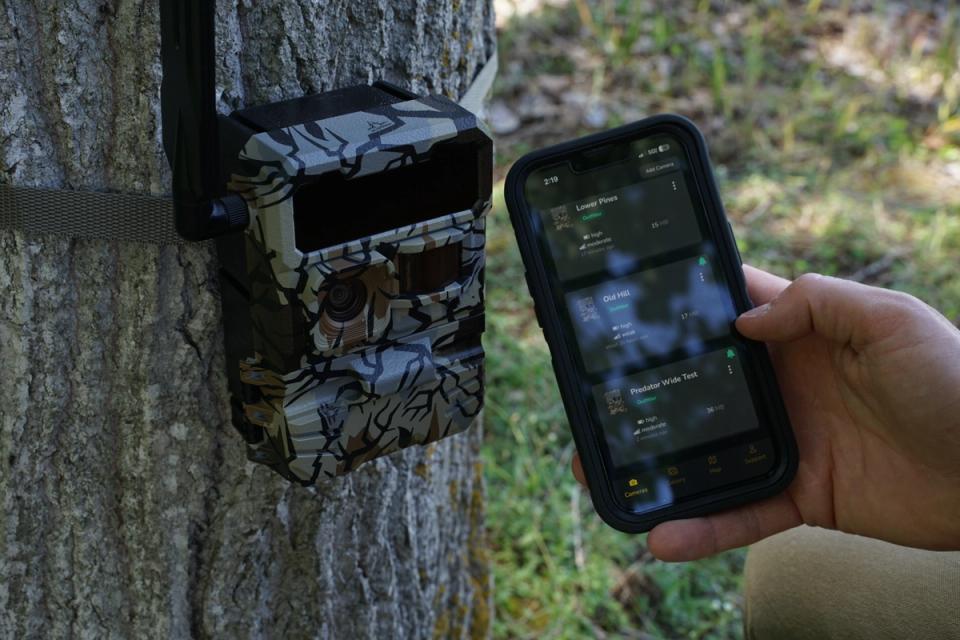 Yellowstone Y2 trail camera beside the Command Center app