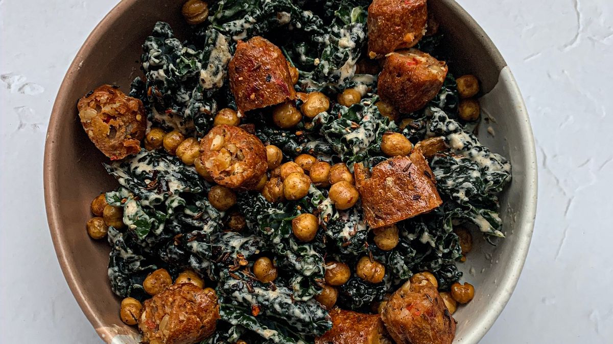 Cavolo Nero massaged with tahini, garlic and lemon juice with crispy chickpeas and veggie sausages