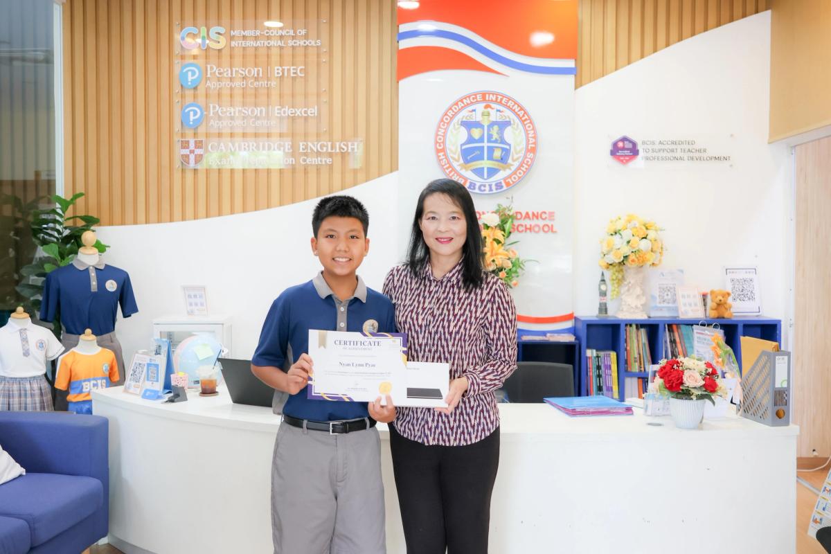 Ethan with the school Founder Amporn Garmolgomut