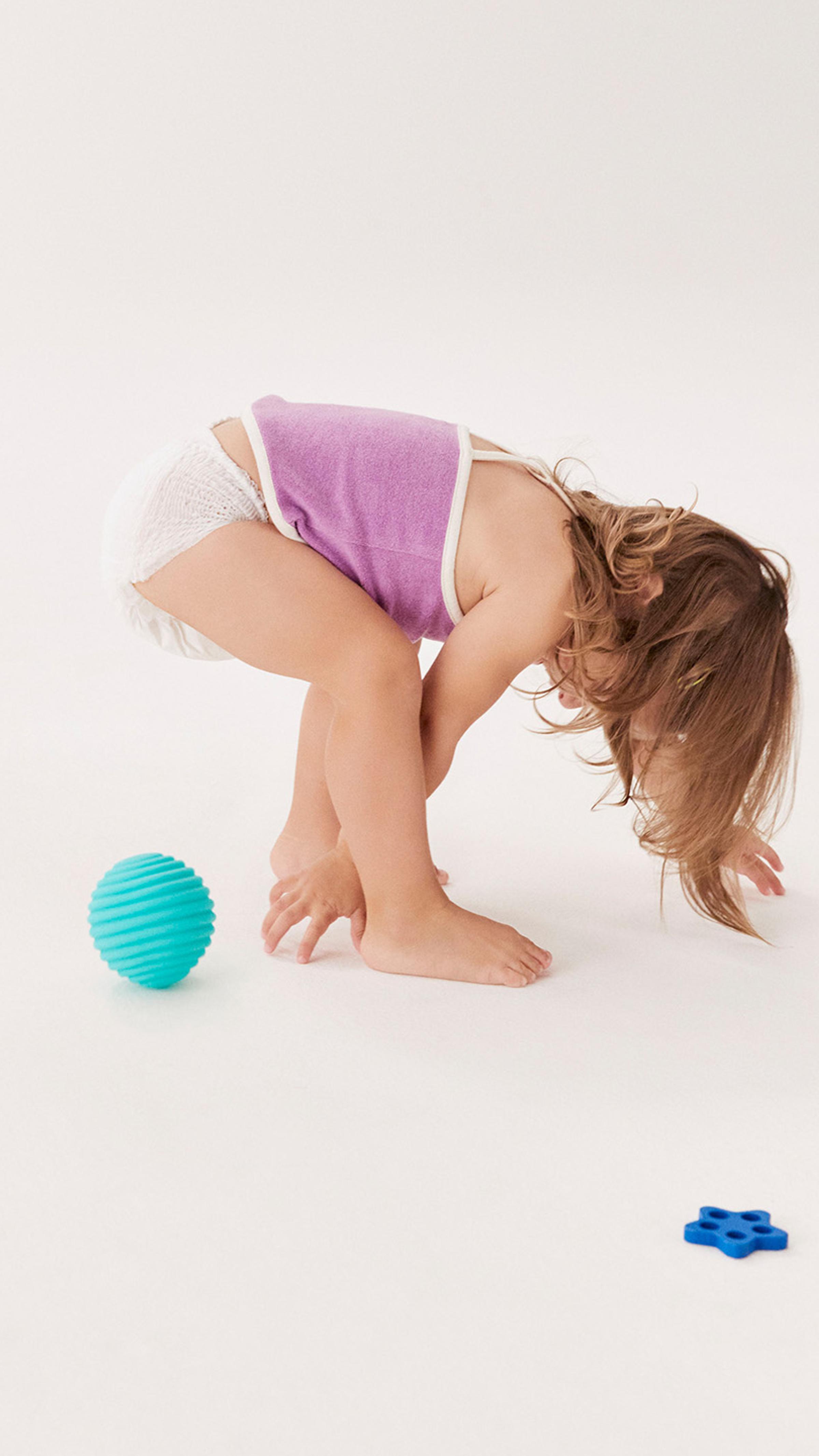 A child playing with a ball.