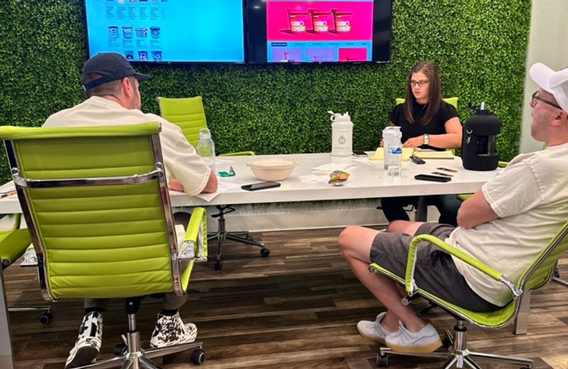 Around the Snacktime Brands conference table, mid-deal