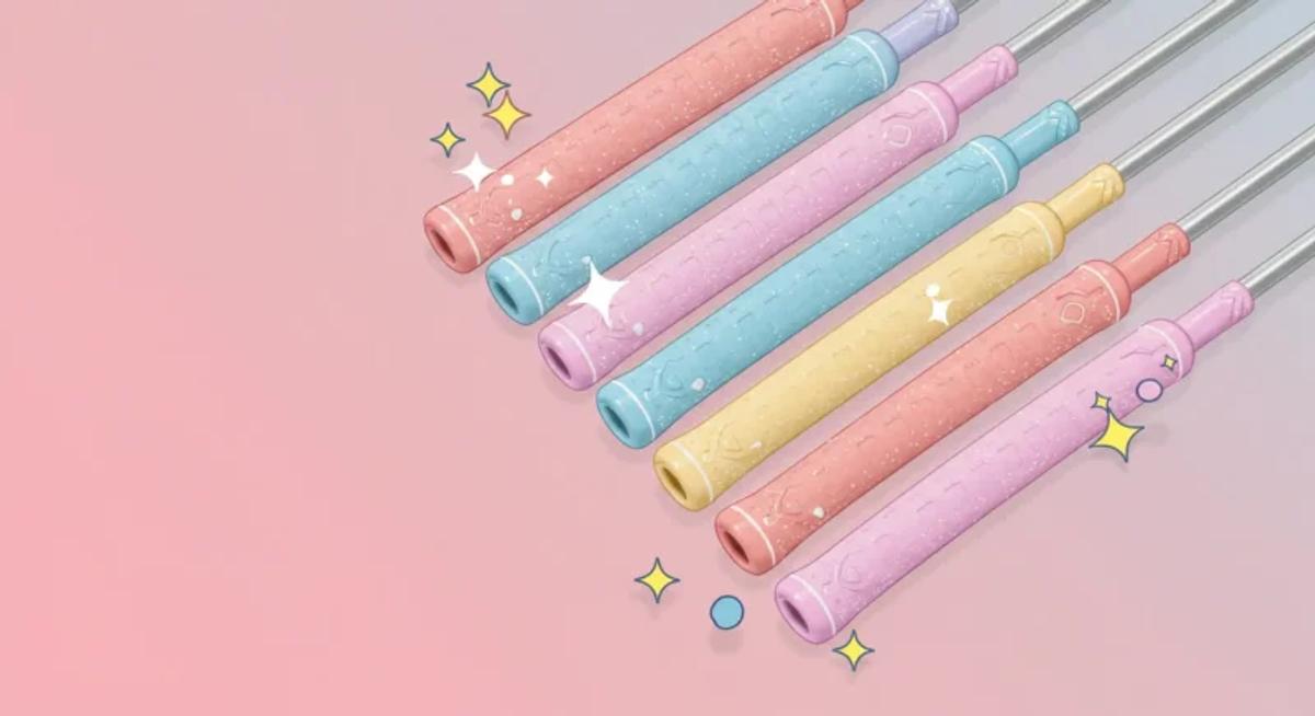 10本のカラフルな女性用グリップを斜めに並べ、ポップでかわいらしい雰囲気を演出した漫画風イラスト。