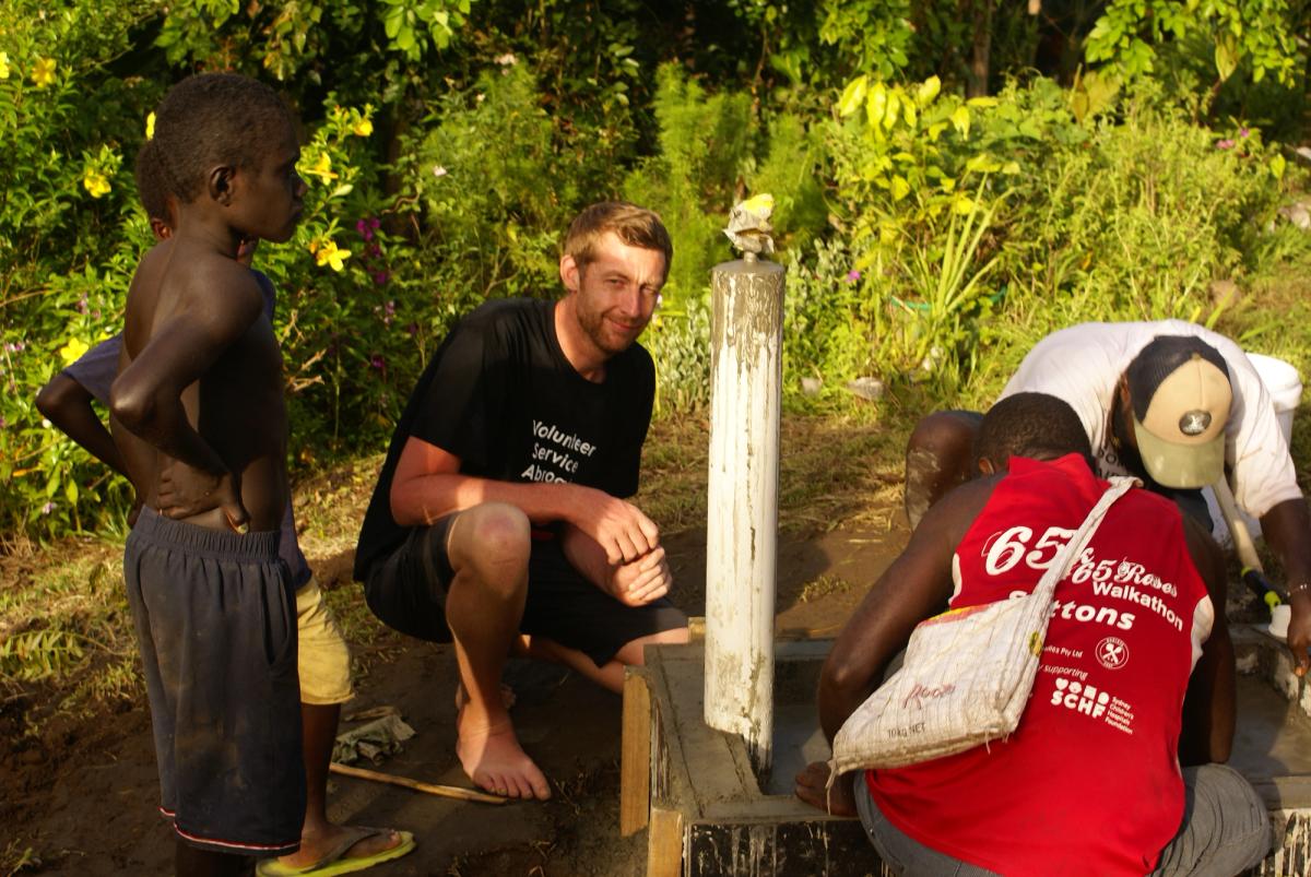 A group of men working on a water system