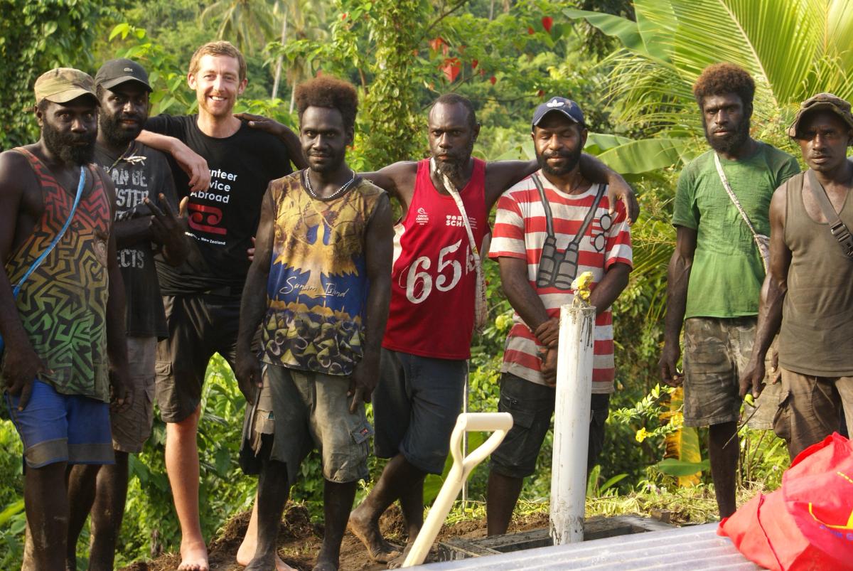 A group of men smiling for the camera